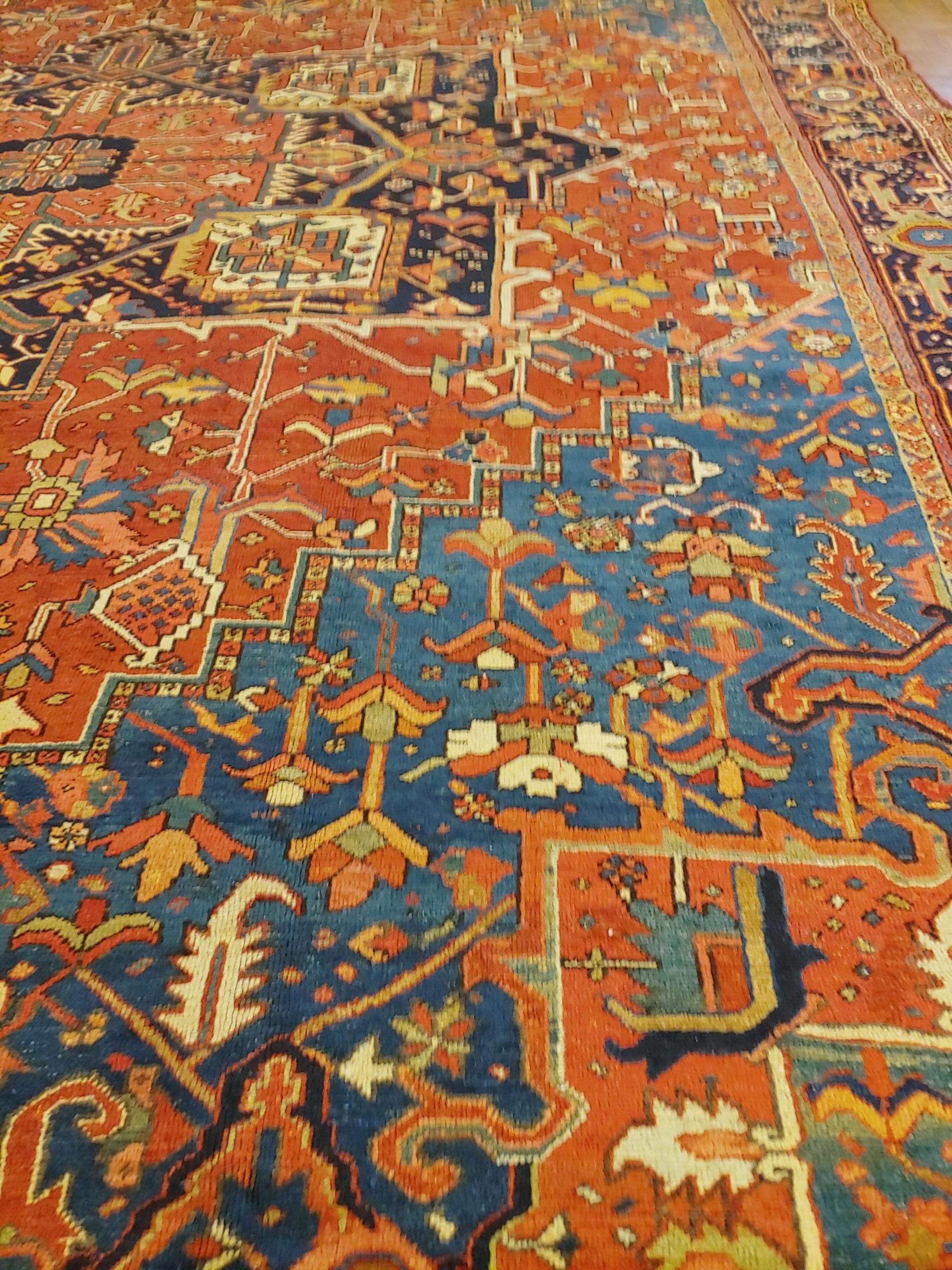 Heriz Serapi Antique Persian Heriz Rug, Rust with Blue and Teal Corners, Wool, 1915 For Sale