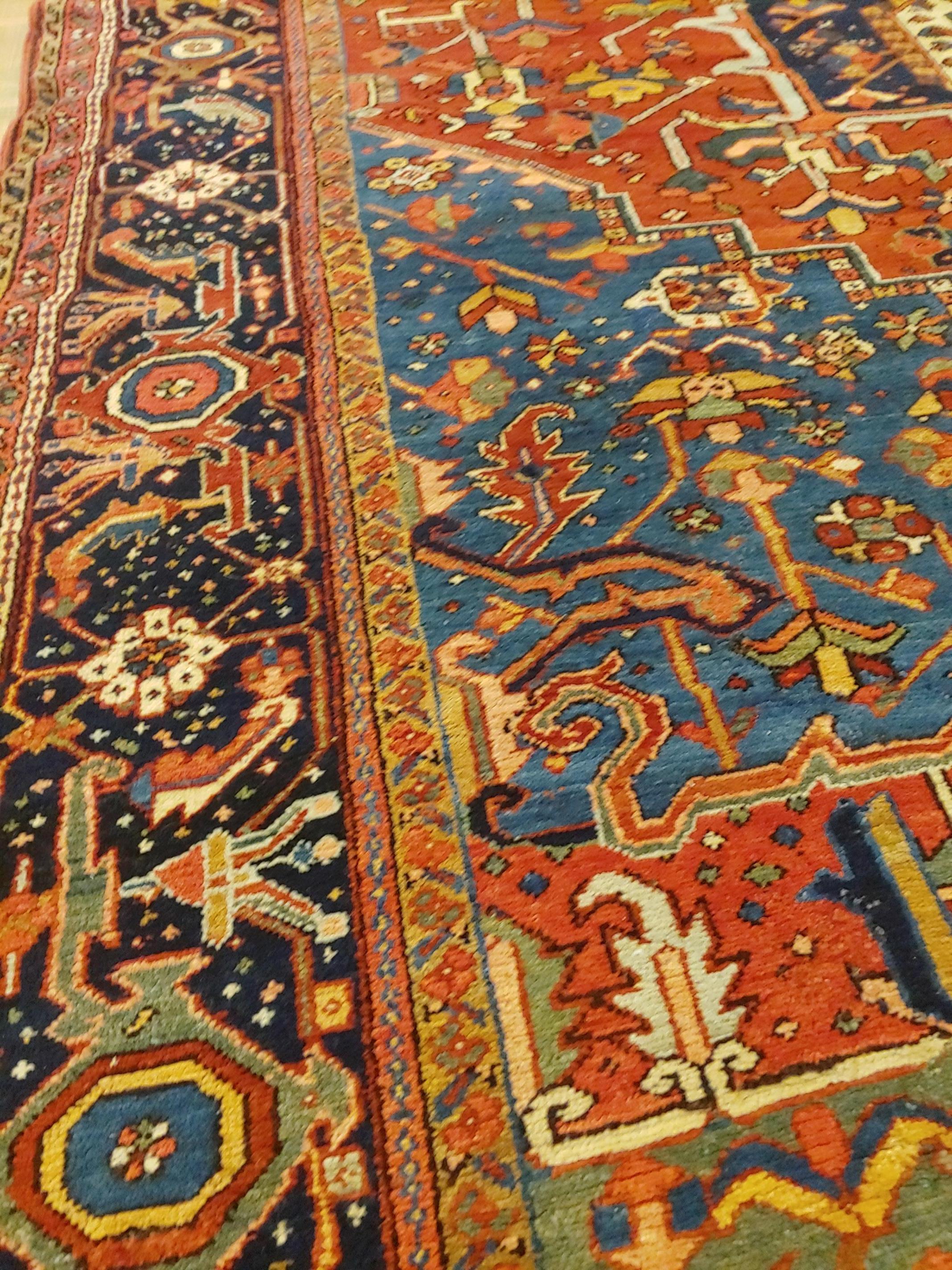 20th Century Antique Persian Heriz Rug, Rust with Blue and Teal Corners, Wool, 1915 For Sale