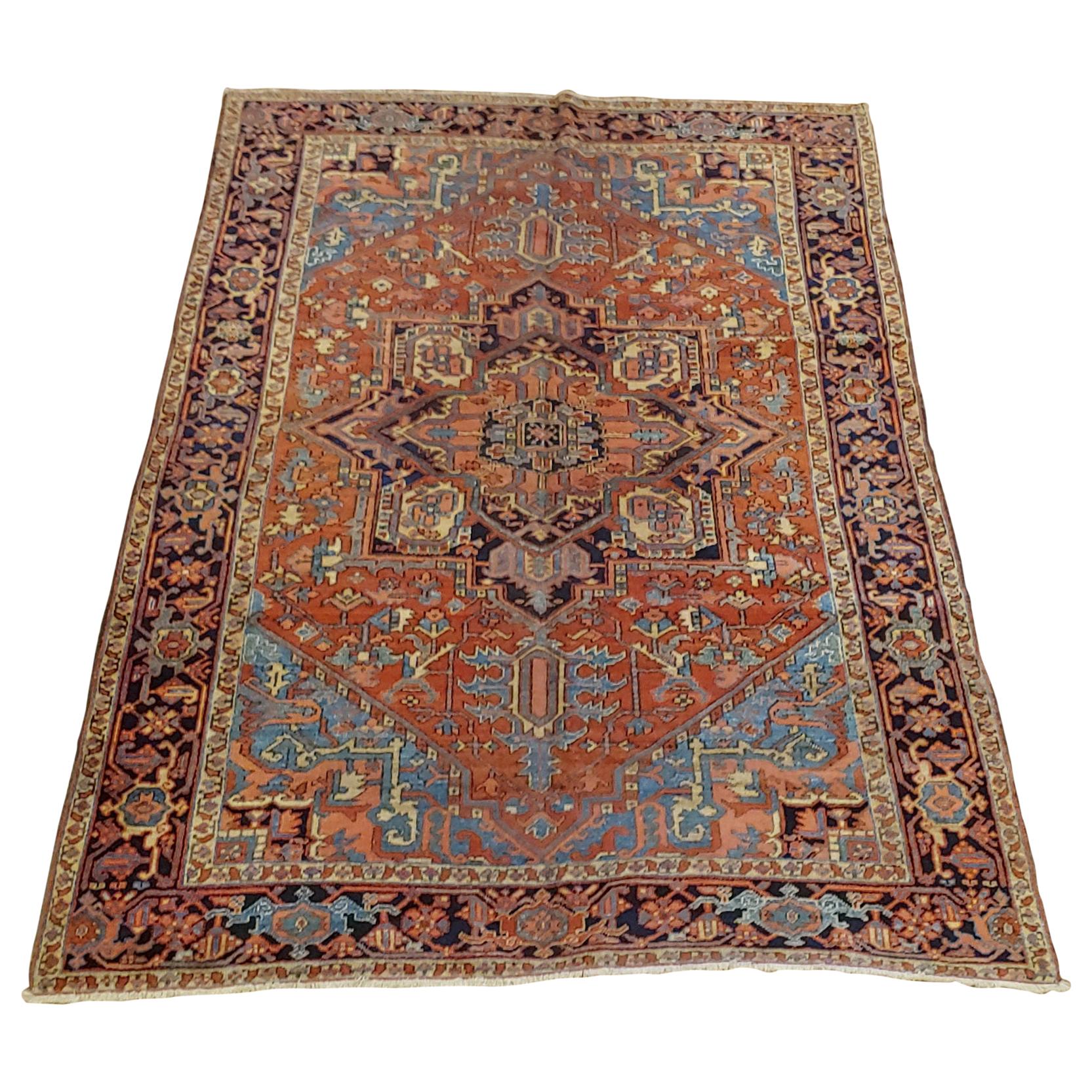 Antique Persian Heriz Rug, Rust With Light Blue Corners, Wool, 1915 For Sale