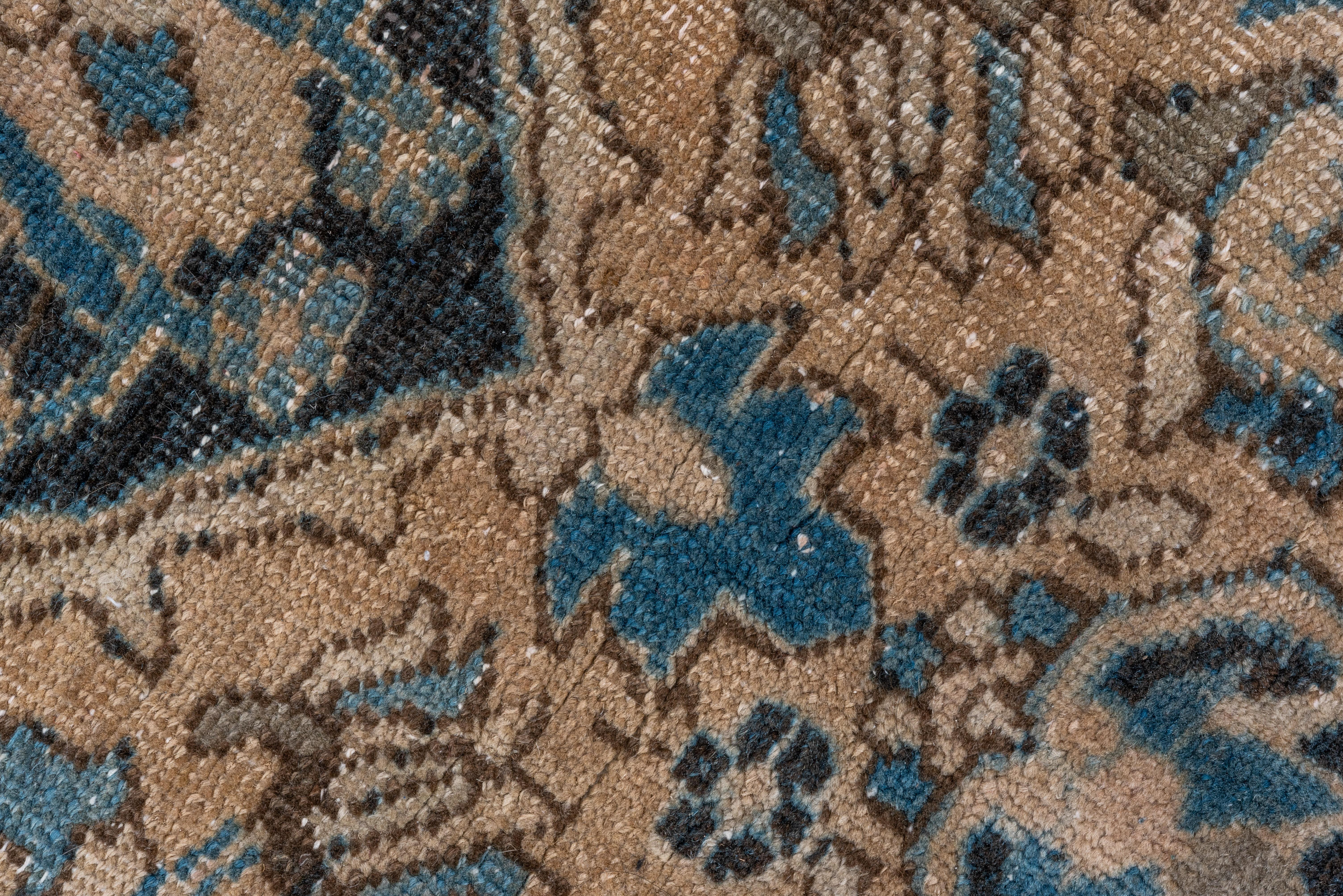 Hand-Knotted Antique Persian Heriz Rug with a Caramel Beige Field, Blue Ahar Medallion For Sale