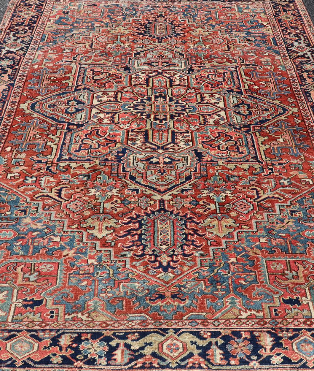 20th Century Antique Persian Heriz Rug with All-Over Sub-Geometric Layered Medallion Design For Sale