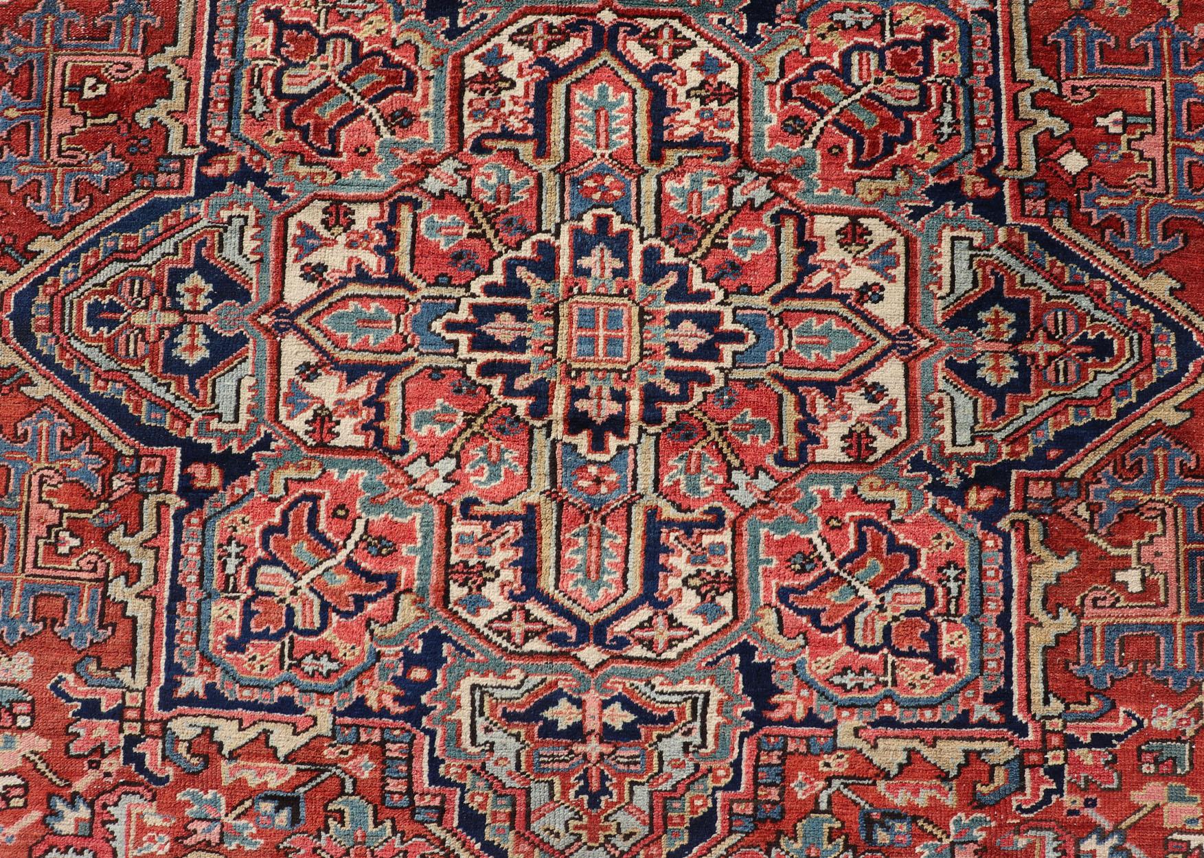 Wool Antique Persian Heriz Rug with All-Over Sub-Geometric Layered Medallion Design For Sale