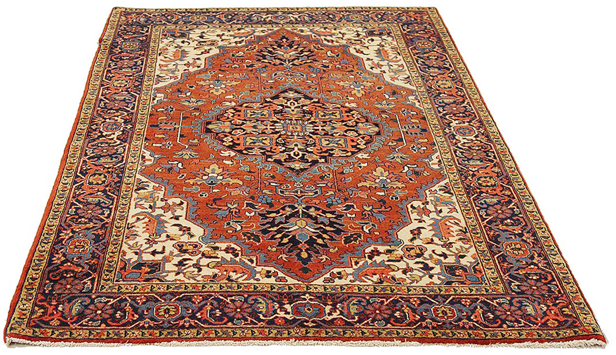 Antique Persian rug handwoven from the finest sheep’s wool and colored with all-natural vegetable dyes that are safe for humans and pets. It’s a traditional Heriz design featuring a lovely red and ivory field with blue and beige floral patterns.