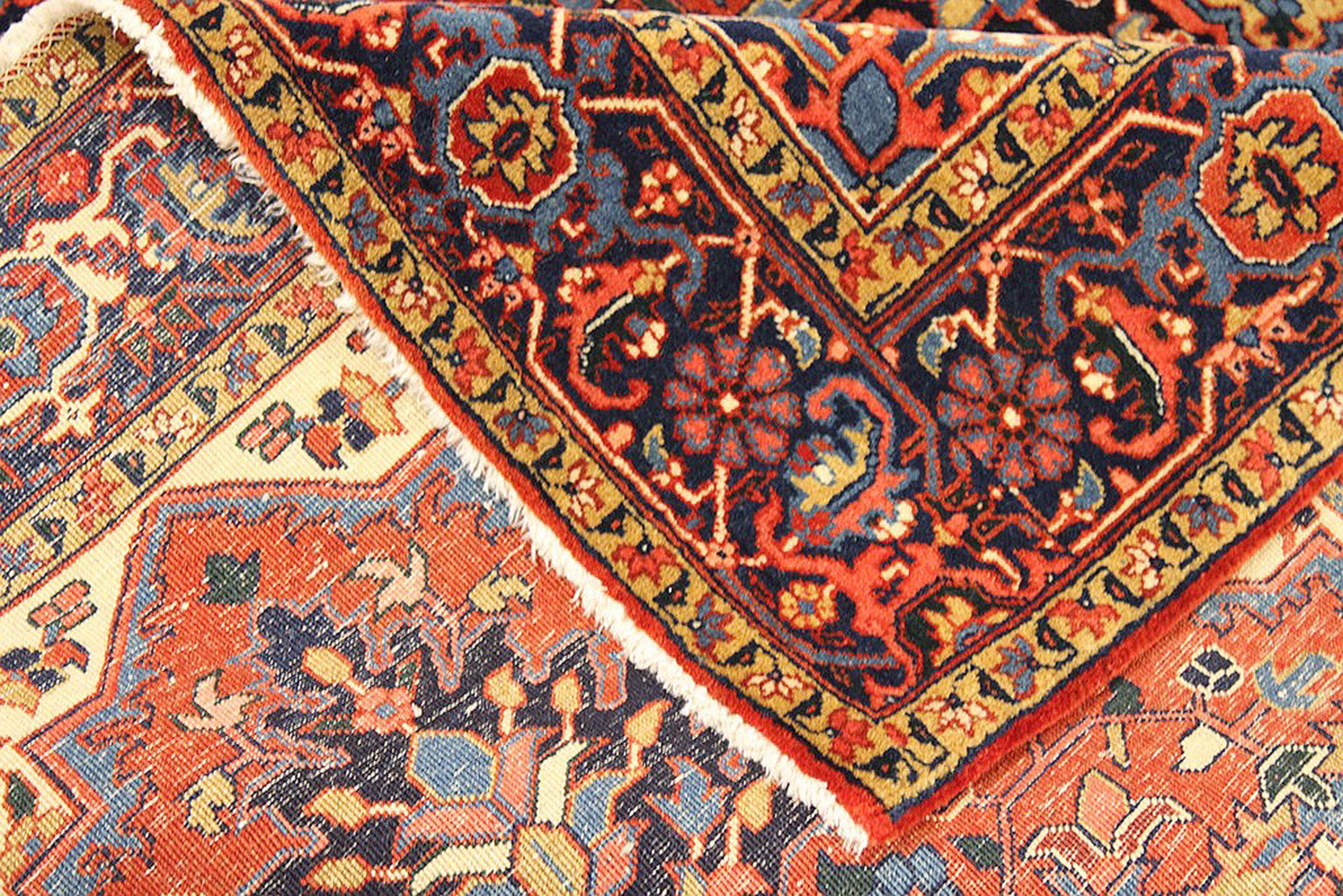 Heriz Serapi Antique Persian Heriz Rug with Beige & Blue Floral Details on Red & Ivory Field For Sale