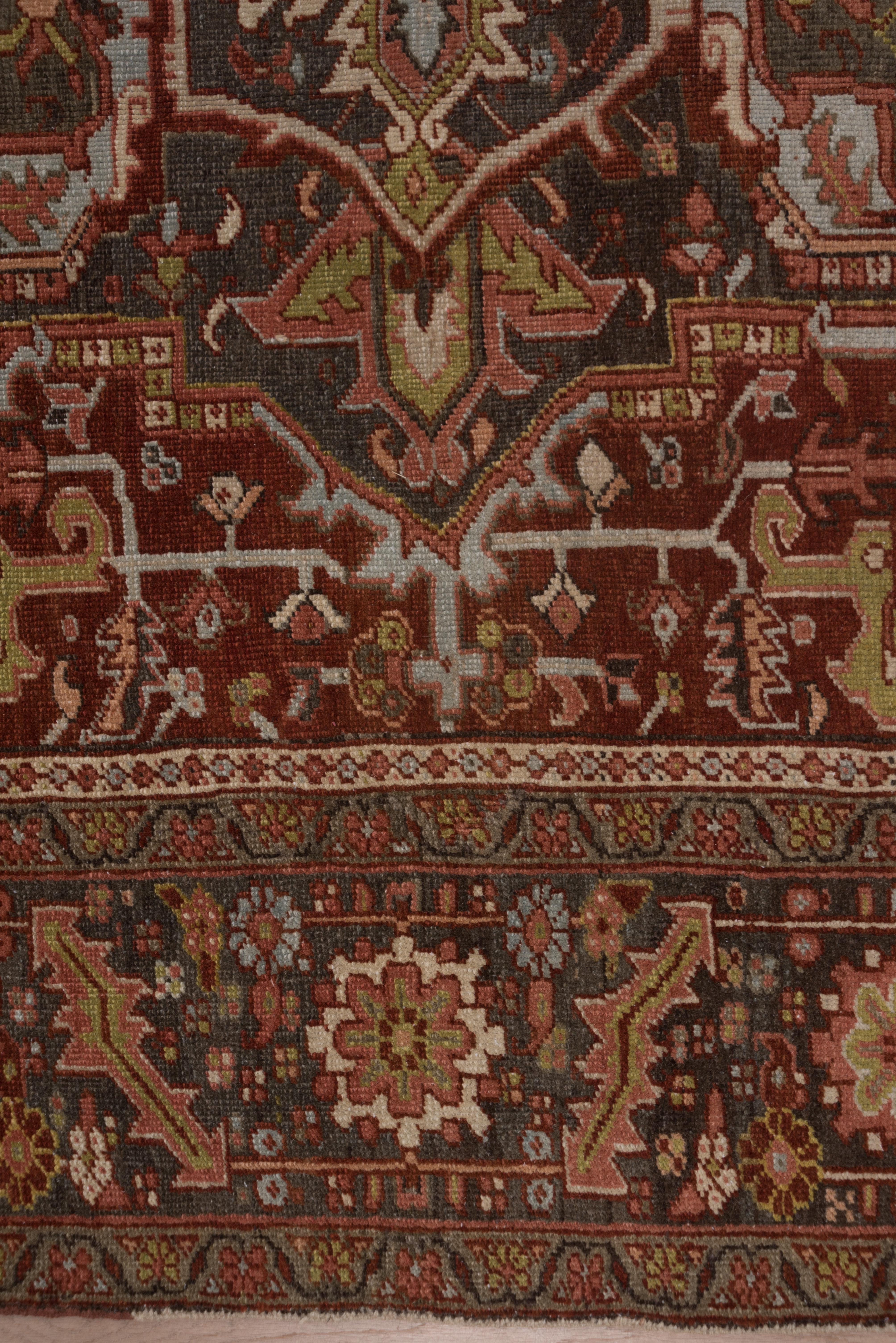 Wool Antique Persian Heriz Rug with Dark & Colorful Tones, Circa 1930s For Sale