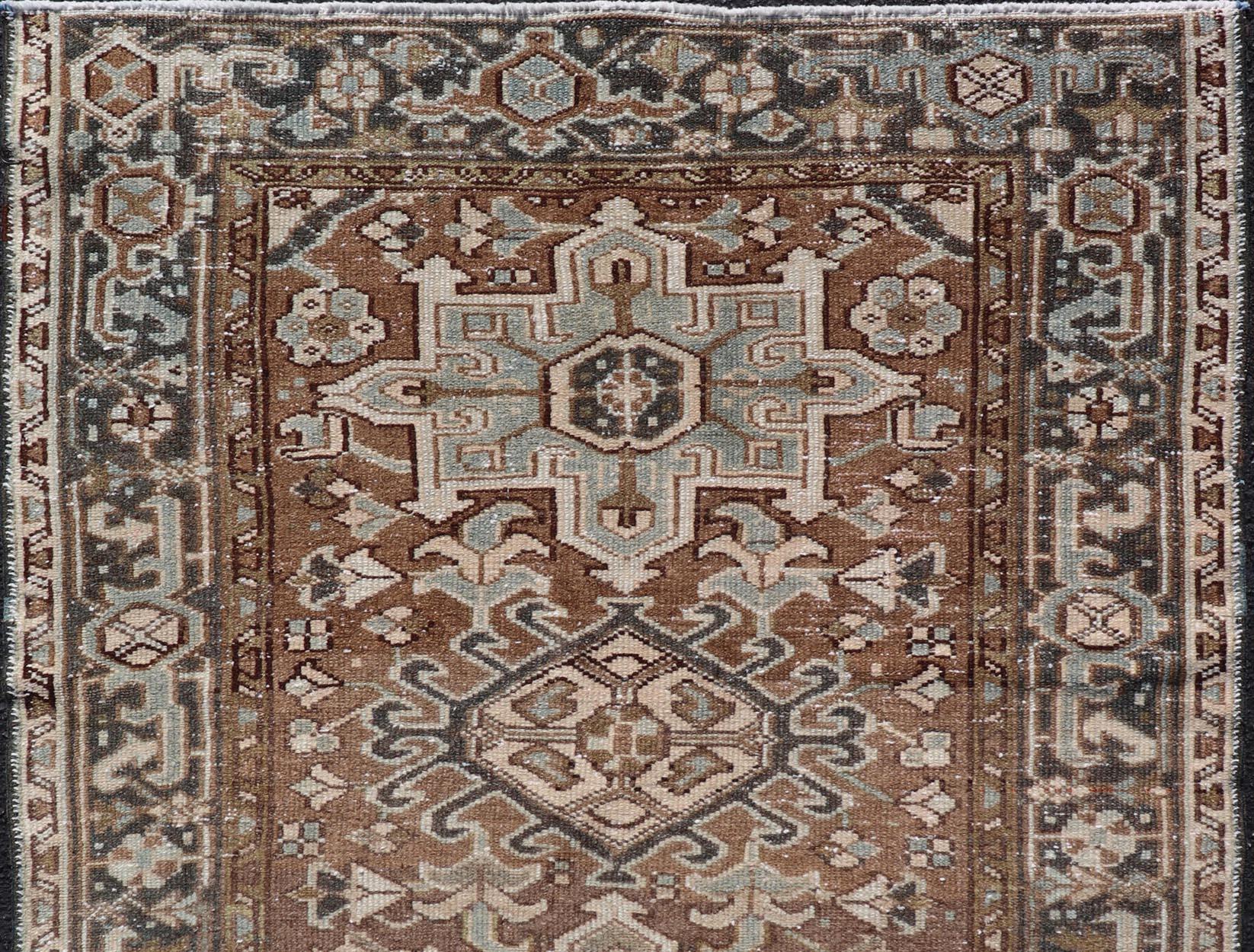 Hand-Knotted Antique Persian Heriz Rug with Geometric Medallion Design in Mocha, Blue, & Tan For Sale