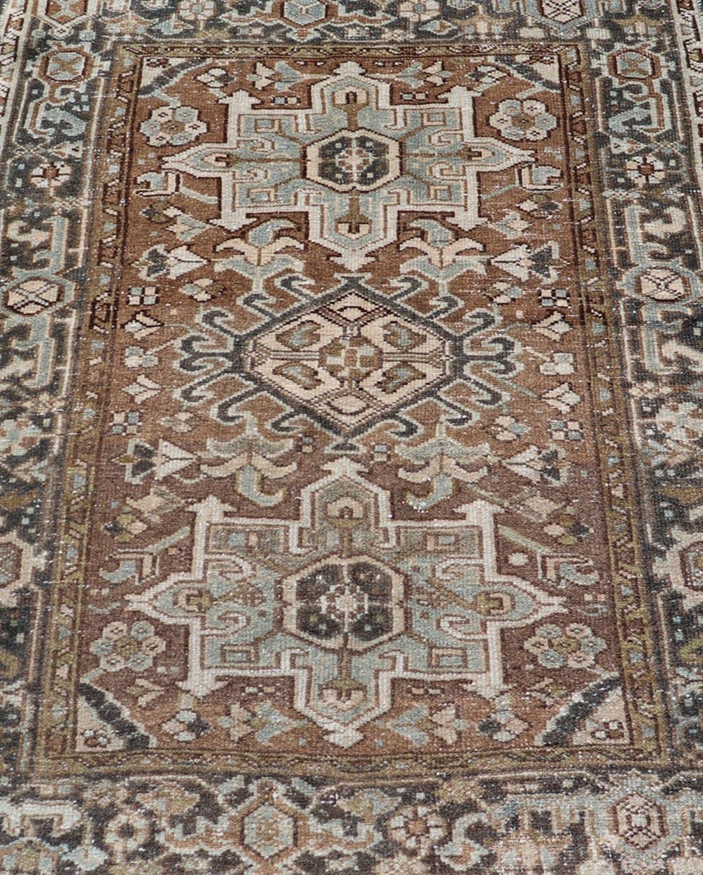 Wool Antique Persian Heriz Rug with Geometric Medallion Design in Mocha, Blue, & Tan For Sale