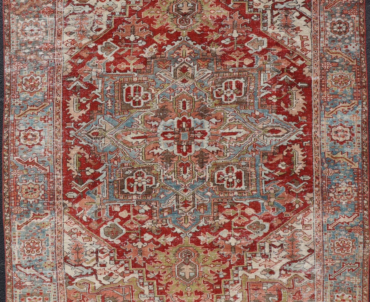 20th Century Antique Persian Heriz Rug With Geometric Medallion Design in Red & Soft Colors For Sale