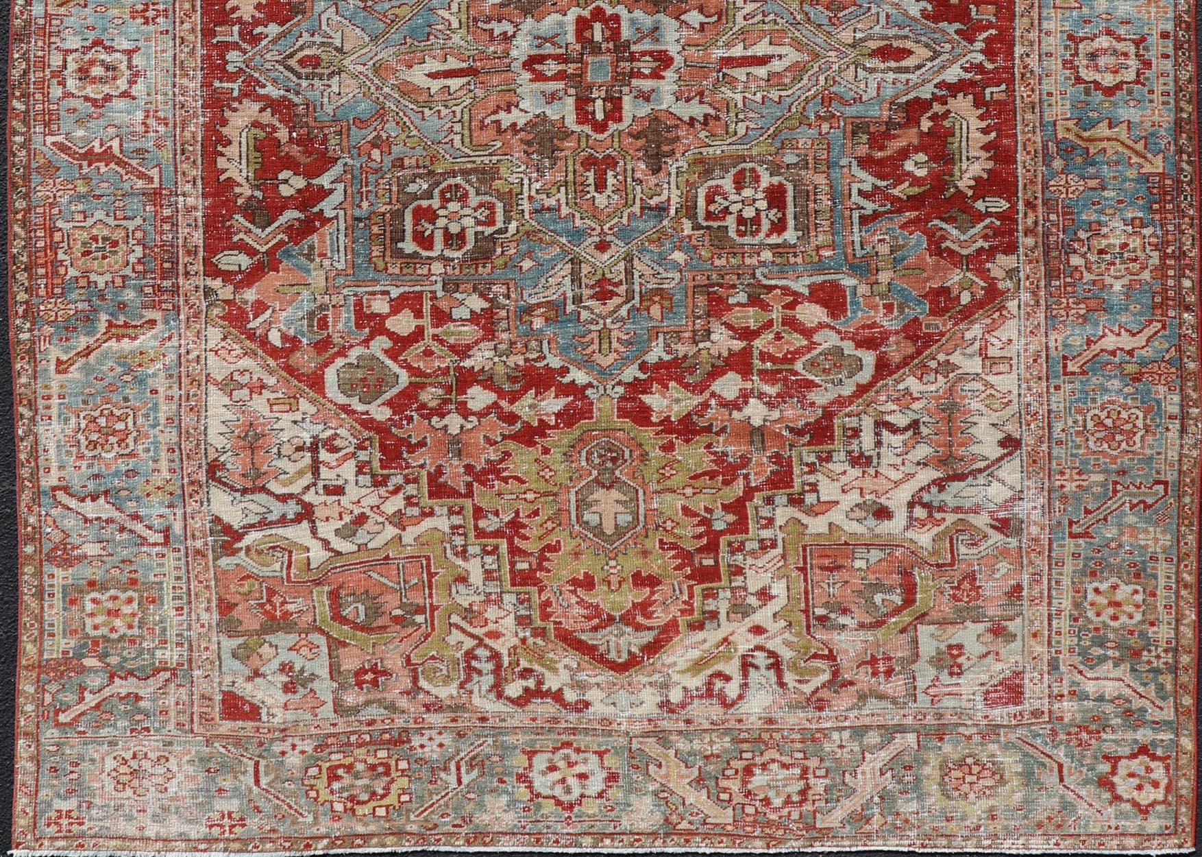 Wool Antique Persian Heriz Rug With Geometric Medallion Design in Red & Soft Colors For Sale