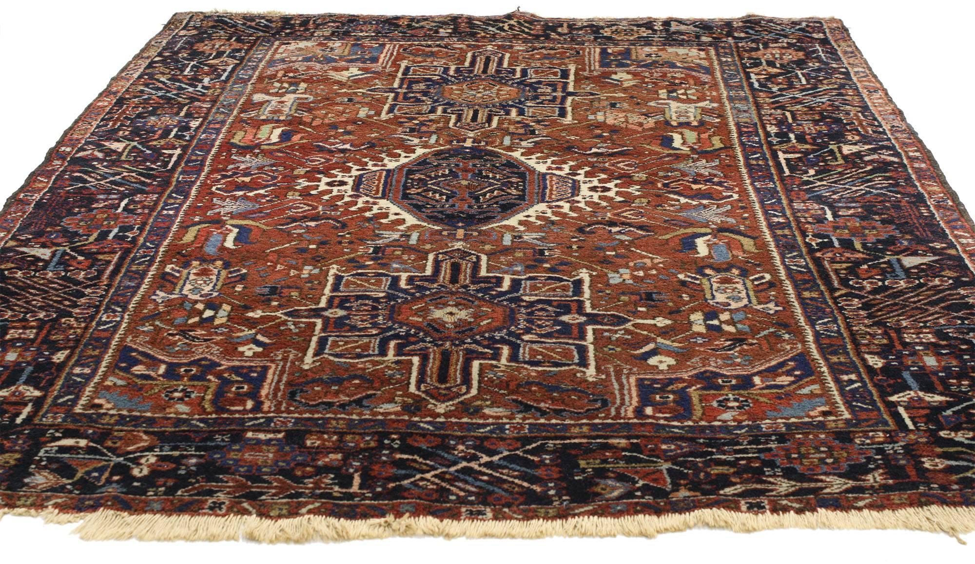 77066 Antique Persian Heriz rug with medallion and cruciform motif. This opulent antique Persian Heriz rug features a central medallion outlined in a geometric Stark ivory thin border flanked by two cruciform style amulets in deep sapphire and