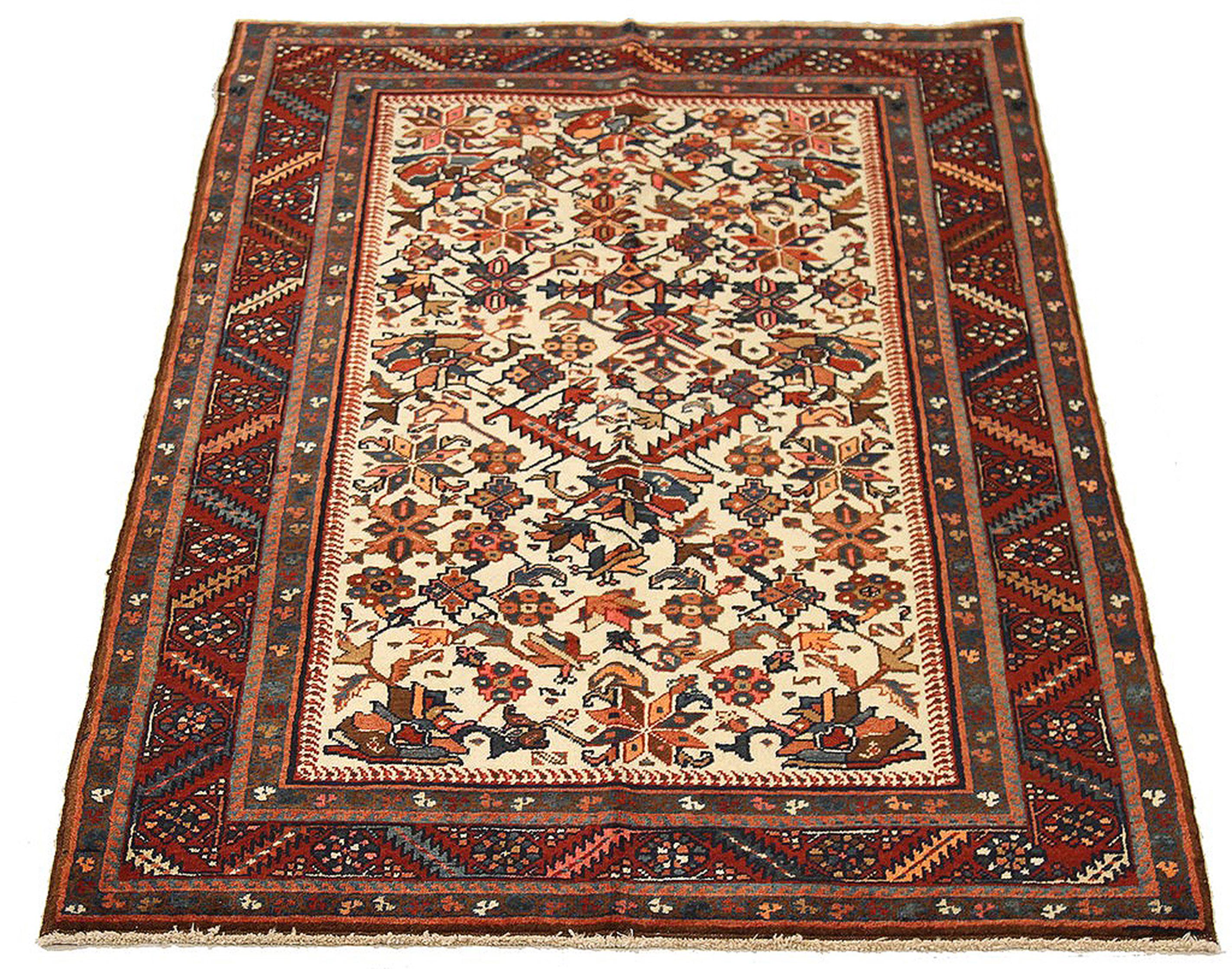 Malayer Antique Persian Heriz Rug with Navy and Red Floral Motifs on Ivory Field For Sale