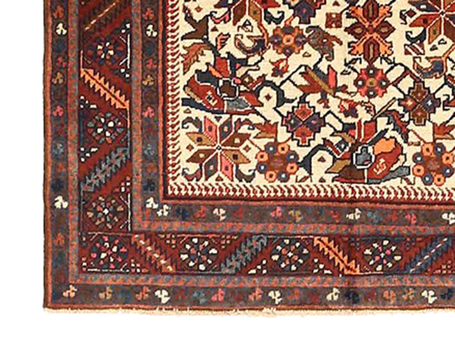 Hand-Woven Antique Persian Heriz Rug with Navy and Red Floral Motifs on Ivory Field For Sale