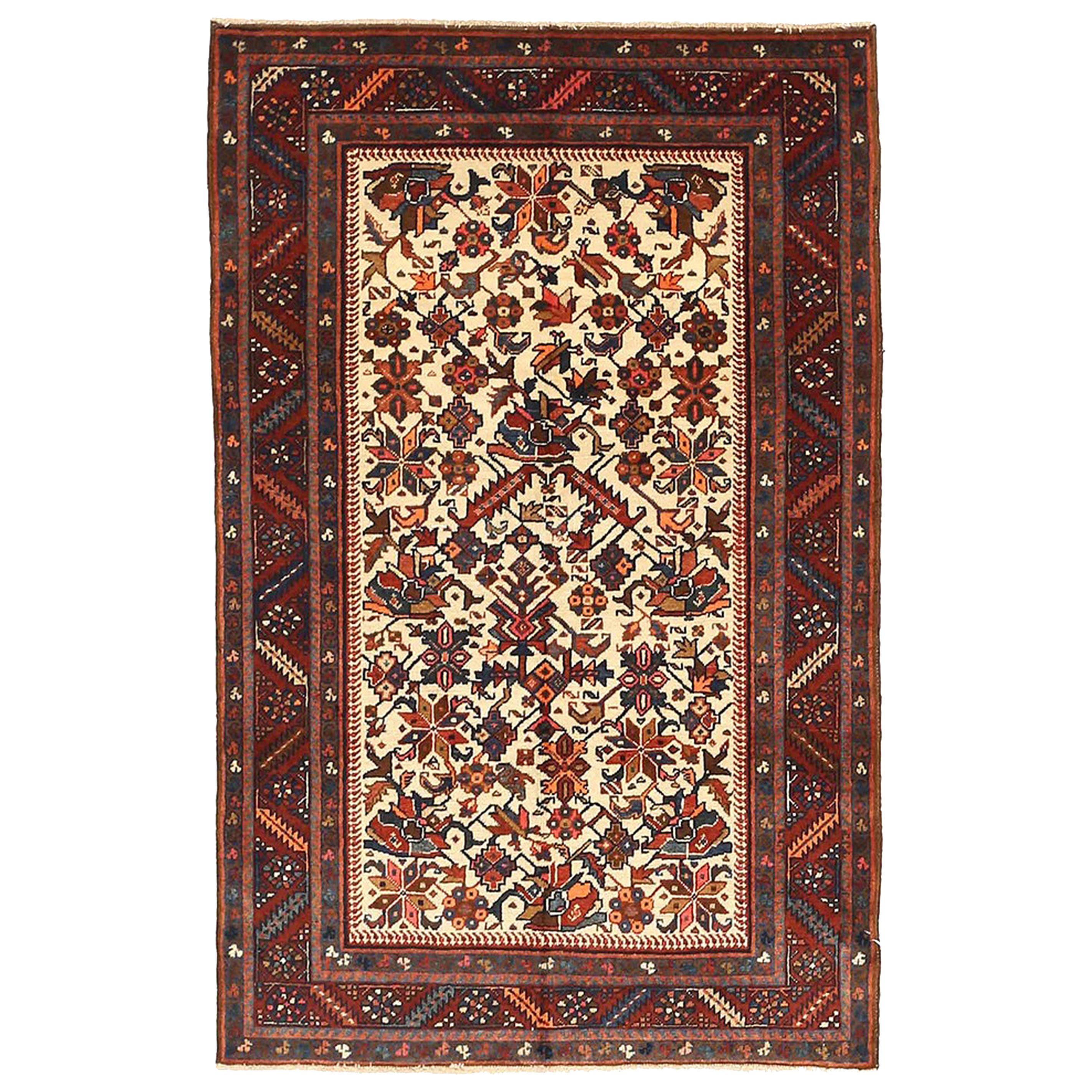 Antique Persian Heriz Rug with Navy and Red Floral Motifs on Ivory Field