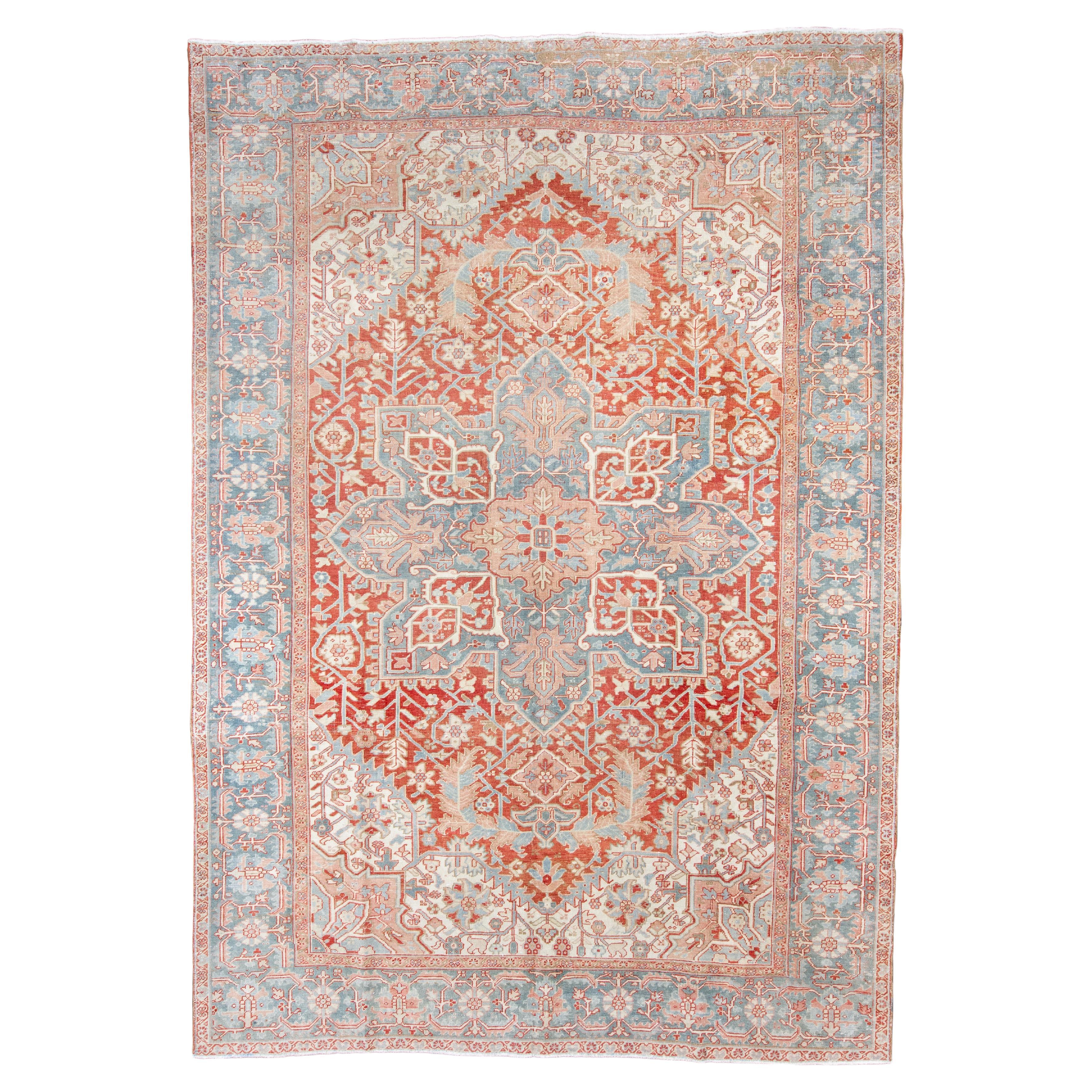 Antique Persian Heriz Rug with Oversized Medallion in Soft Coral and Pale Blue For Sale