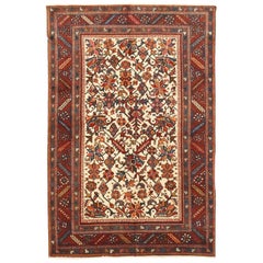 Antique Persian Heriz Rug with Red and Navy Floral Details on Ivory Center Field