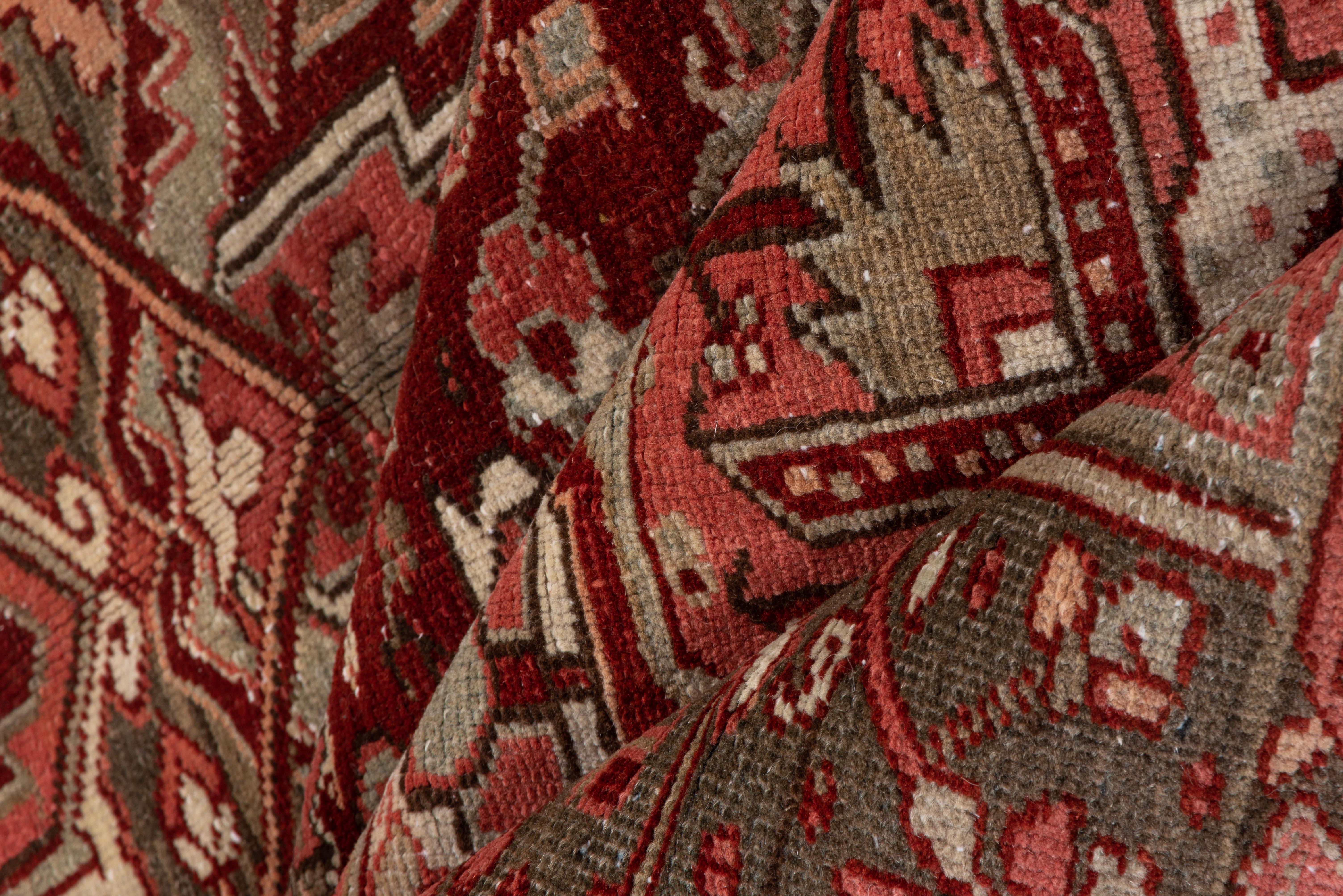 Heriz Serapi Antique Persian Heriz Rug, with Red, Olive Green & Coral Tones, circa 1930s For Sale