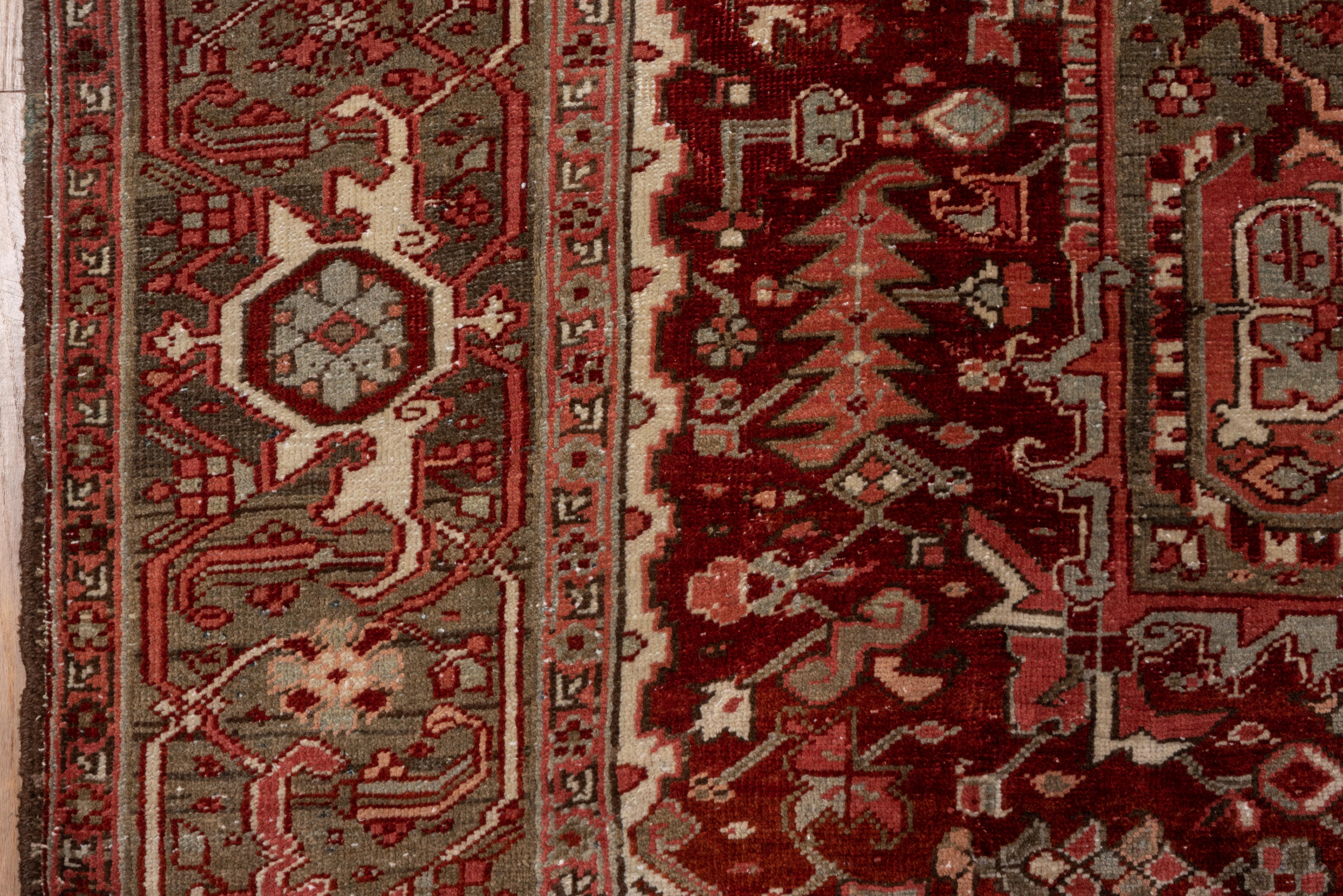 Wool Antique Persian Heriz Rug, with Red, Olive Green & Coral Tones, circa 1930s For Sale
