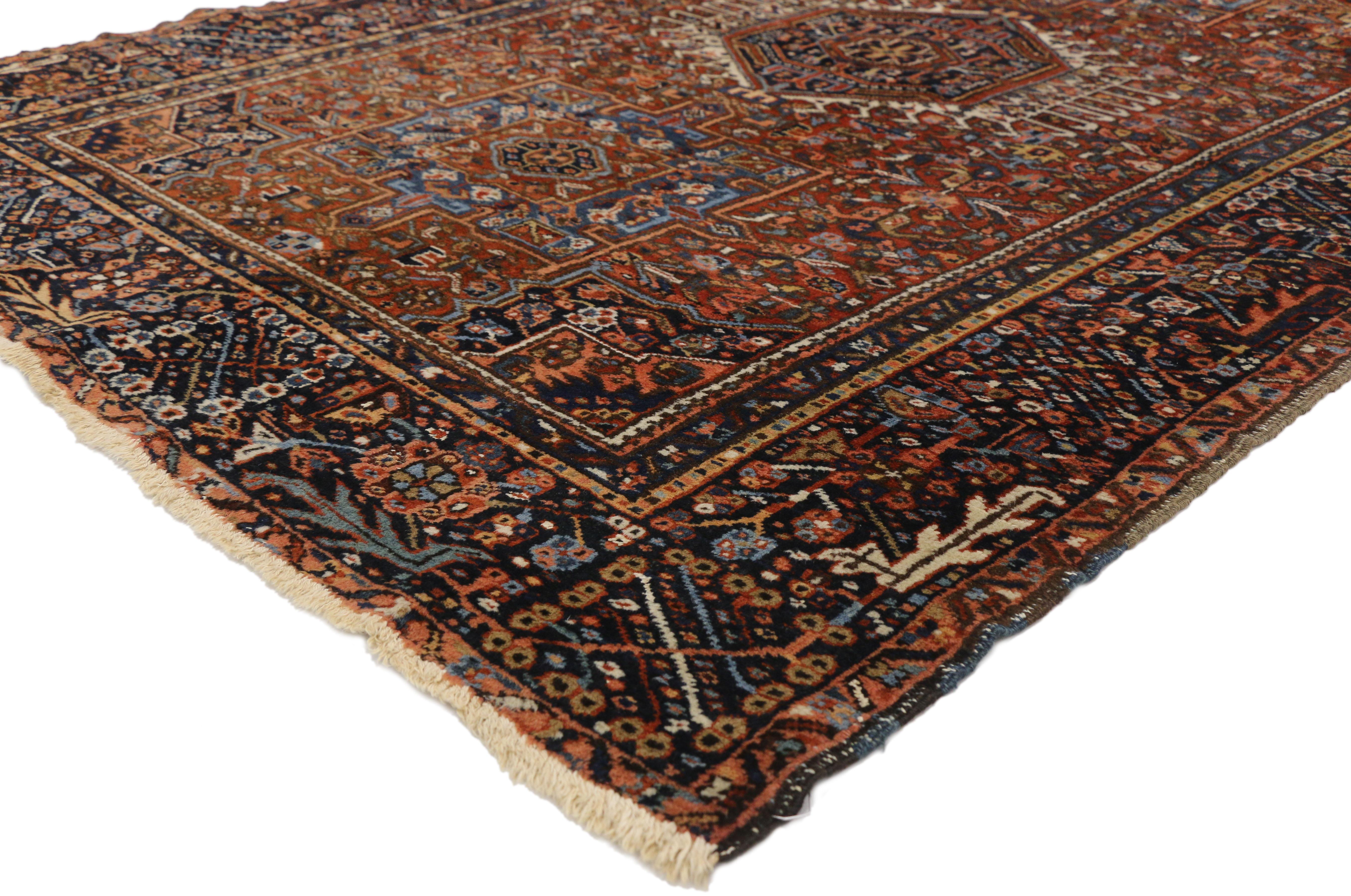 77064 Antique Persian Heriz Rug with Tribal Style, Study or Home Office Rug 04'07 x 06'06. This hand-knotted wool antique Persian Heriz rug features three medallions with cruciform motifs. The central medallion outlined in a geometric stark ivory