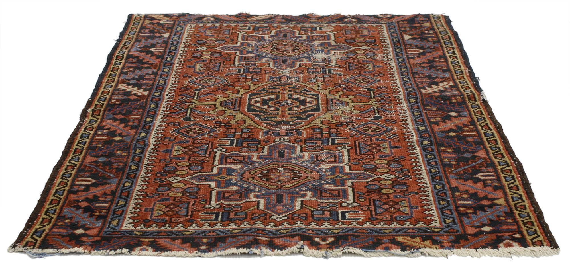 77072, antique Persian Heriz rug with tribal style. This hand-knotted wool antique Persian Heriz rug features three medallions with cruciform motifs. The central medallion is flanked by two cruciform style amulets outlined in geometric Stark ivory