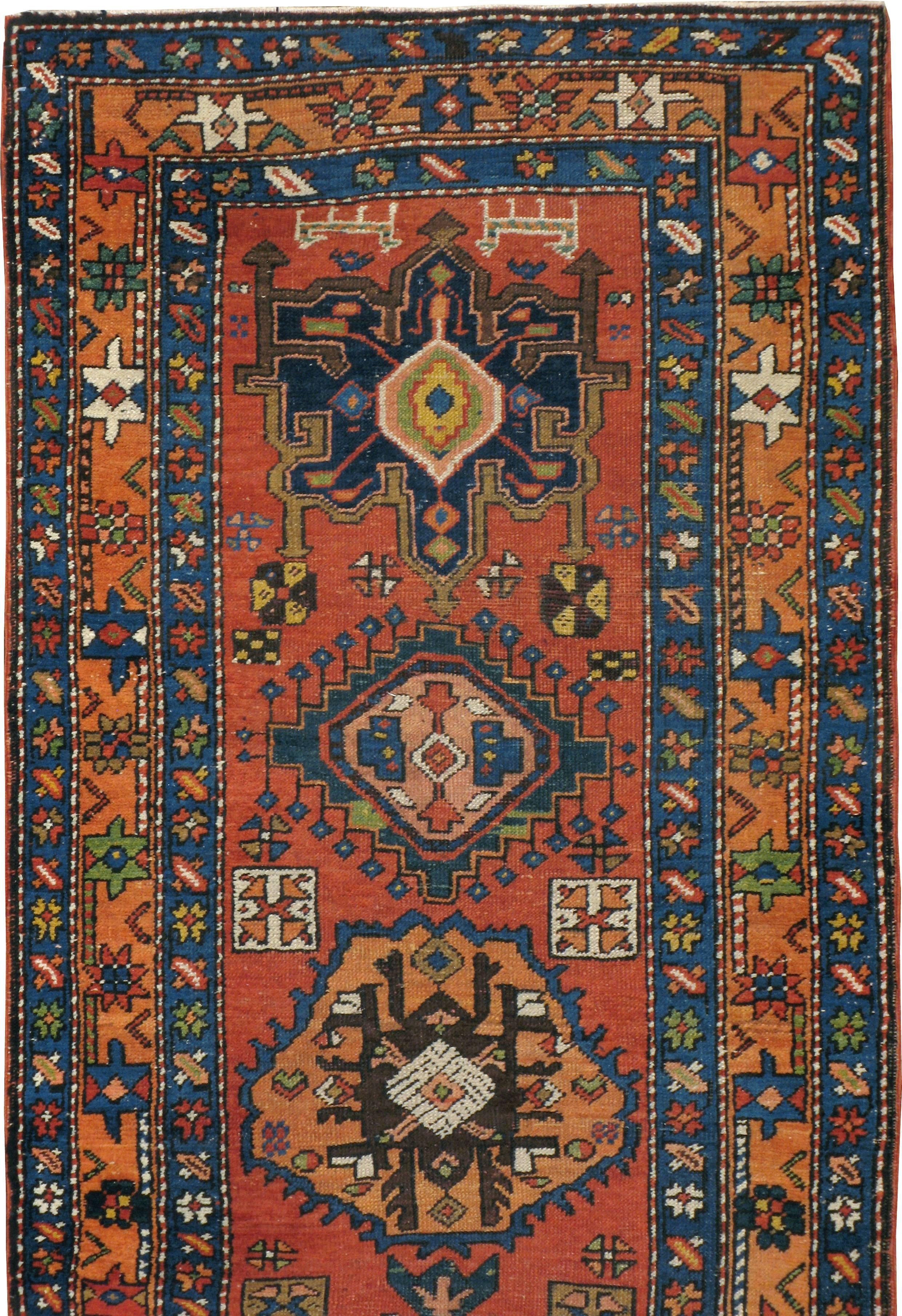 An antique Persian Heriz rug from the early 20th century.