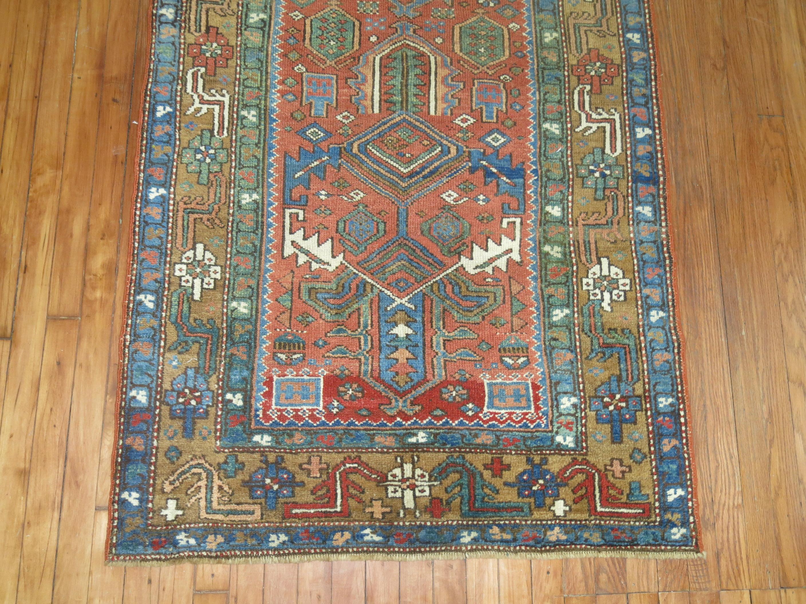 A one of a kind decorative antique Persian Heriz runner.

With distinctive large-scale motifs and a wide ranging palette of warm colors, the antique Heriz carpet is probably the most popular of the Persian village carpets. In constant, increasing