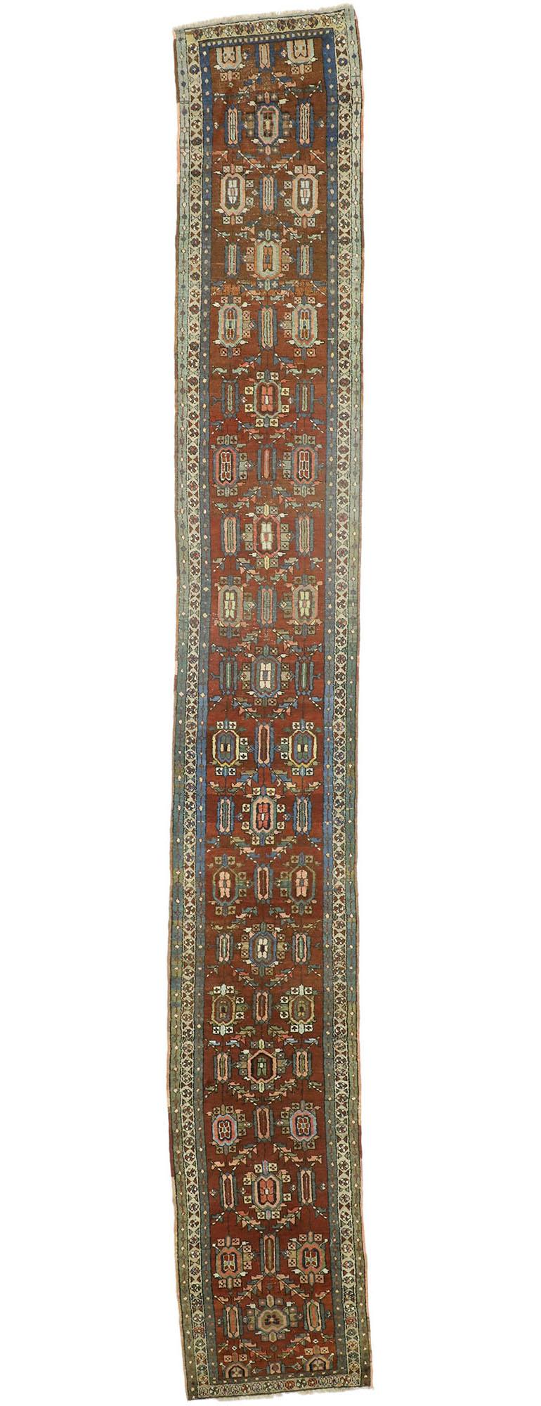 73240 Antique Persian Heriz Runner with Modern Rustic Artisan Style, Extra-Long Runner 02'05 x 17'03. Warm and inviting, this hand-knotted wool distressed antique Persian Heriz runner showcases a modern rustic artisan style. It features an all-over