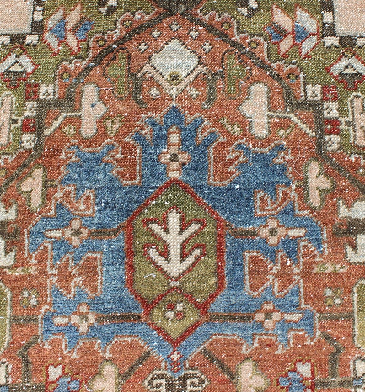 Early 20th Century Antique Persian Heriz Runner with Geometric Medallion Design in Red, Olive, Blue For Sale