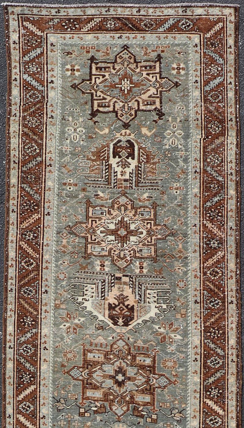 20th Century Antique Persian Heriz Runner with Geometric Medallions For Sale