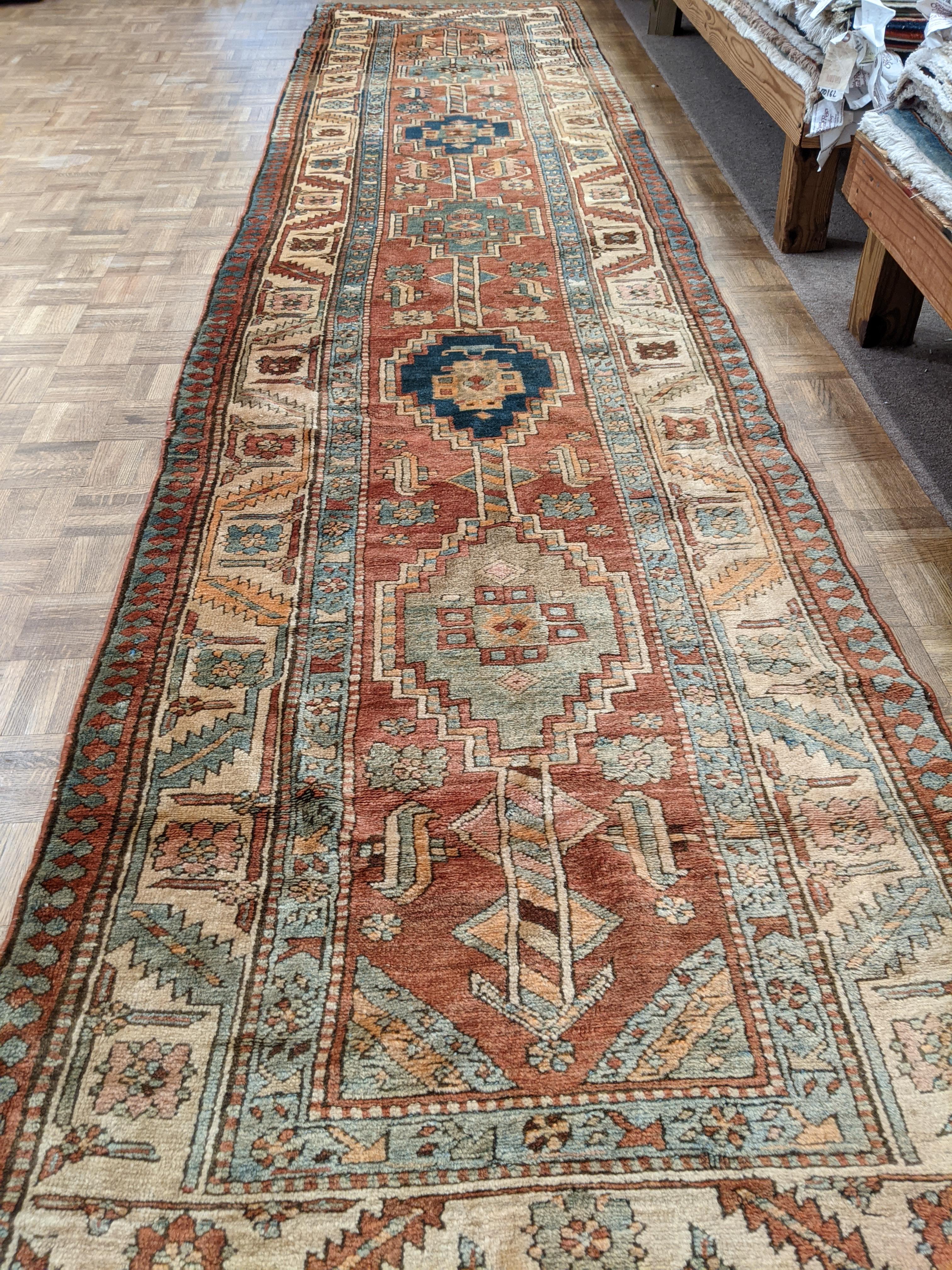 This is a great example of a Persian Heriz hallway runner. Small Heriz rugs are very hard to find and especially runners that are still in good condition. This rug is old enough that some would call it a Serapi. The size is 3-1x13-6. It is in