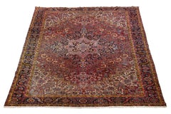 Antique Persian Heriz Wool Rug Featuring an Allover Motif In Red
