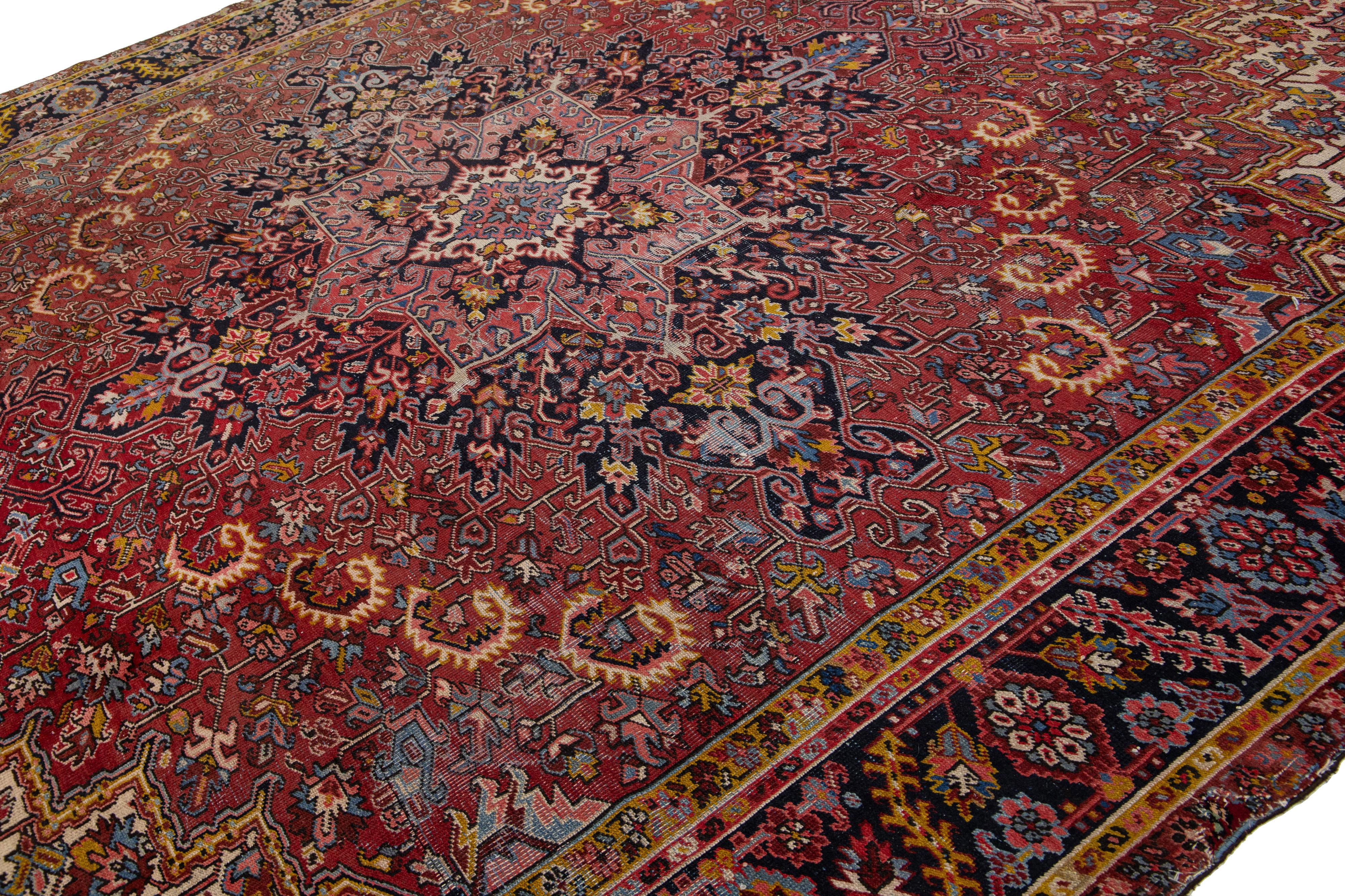 Heriz Serapi Antique Persian Heriz Wool Rug Featuring an Allover Motif In Red For Sale
