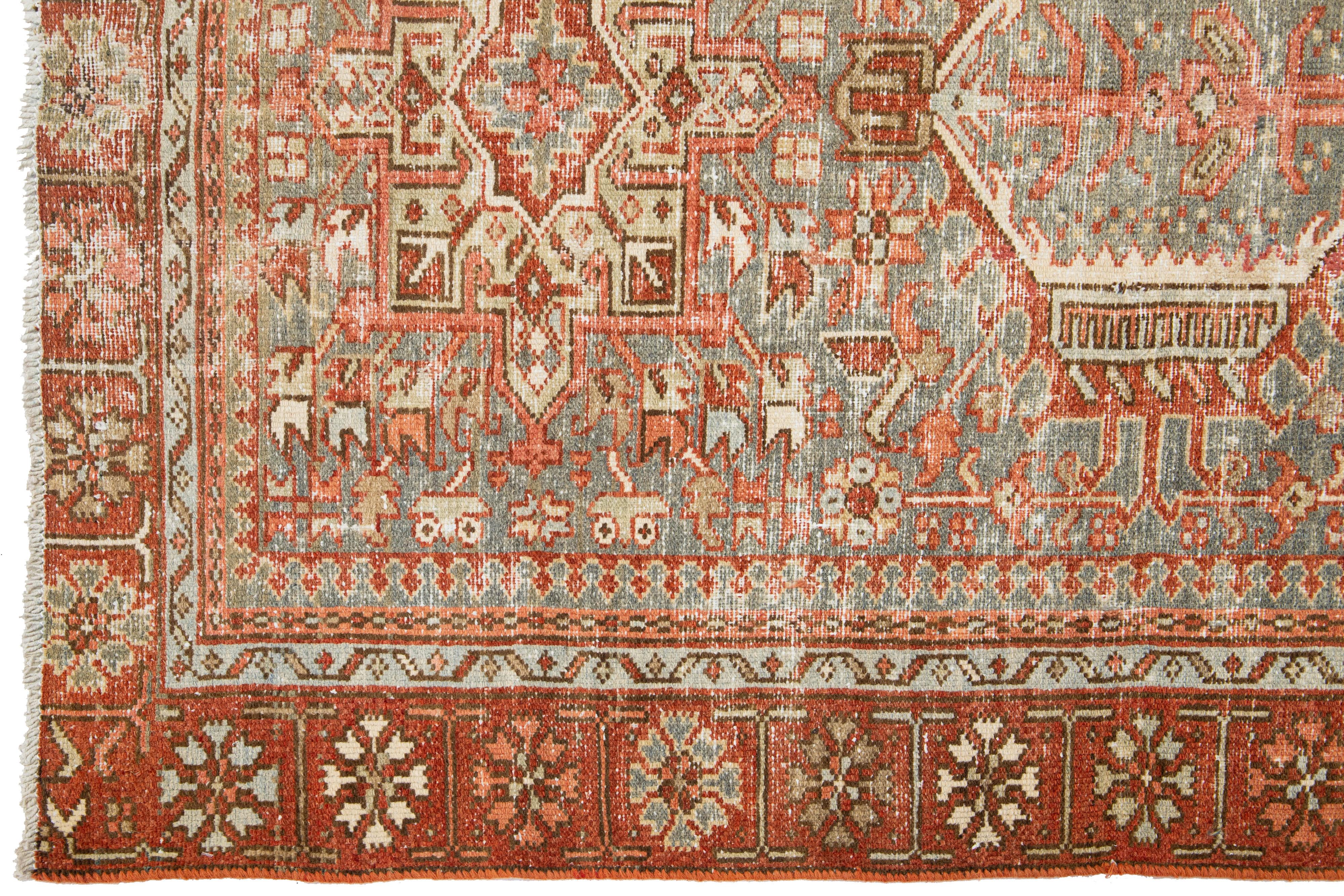 Heriz Serapi Antique Persian Heriz Wool Rug Featuring an Allover Motif In Rust For Sale