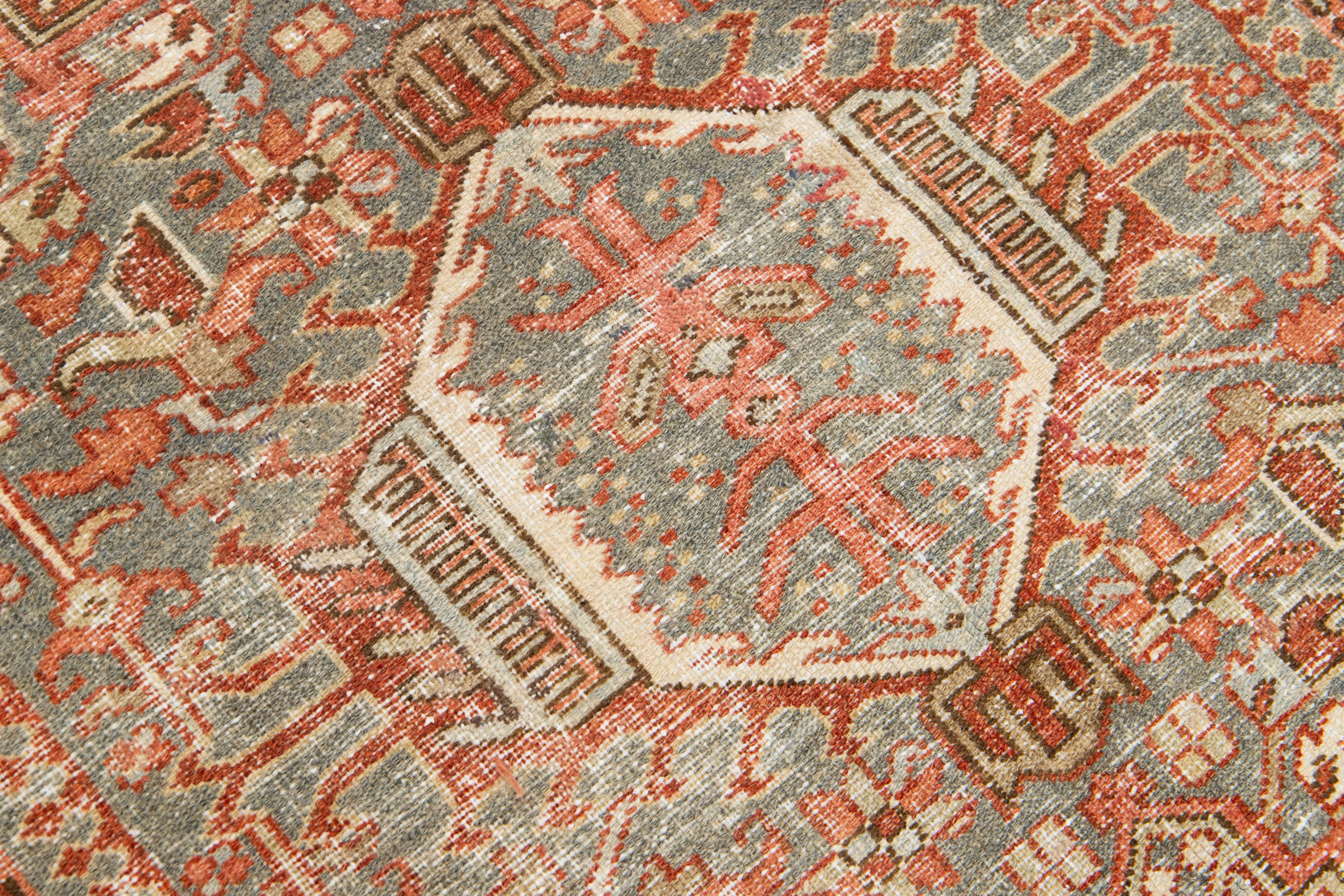 Antique Persian Heriz Wool Rug Featuring an Allover Motif In Rust In Good Condition For Sale In Norwalk, CT