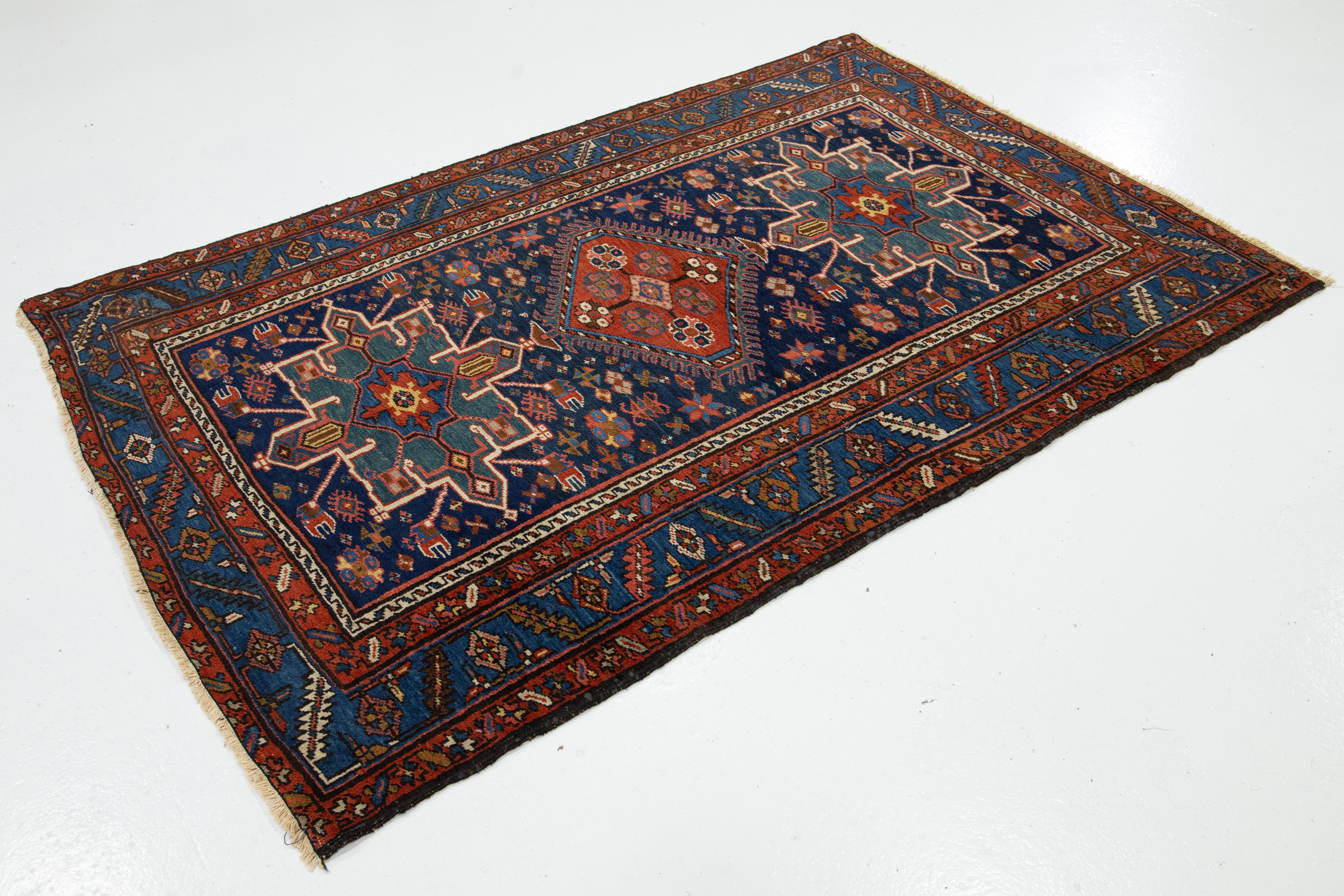 Heriz Serapi Antique Persian Heriz Wool Rug Handmade In Navy Blue With Tribal Design For Sale