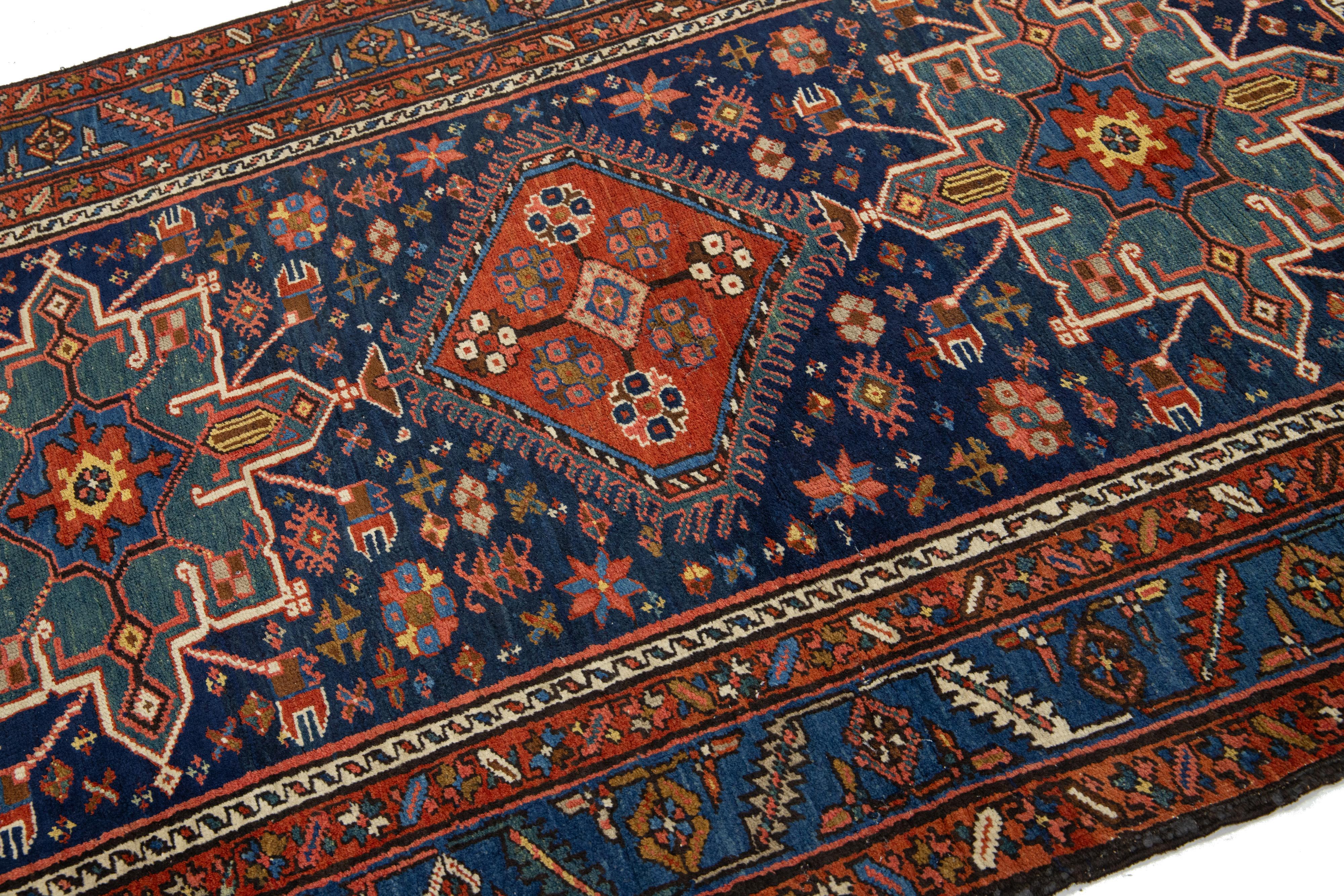 Hand-Knotted Antique Persian Heriz Wool Rug Handmade In Navy Blue With Tribal Design For Sale