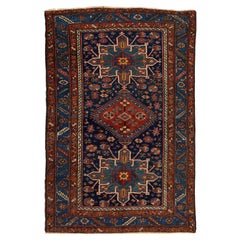 Antico tappeto persiano in lana Heriz fatto a mano in blu navy con disegno tribale