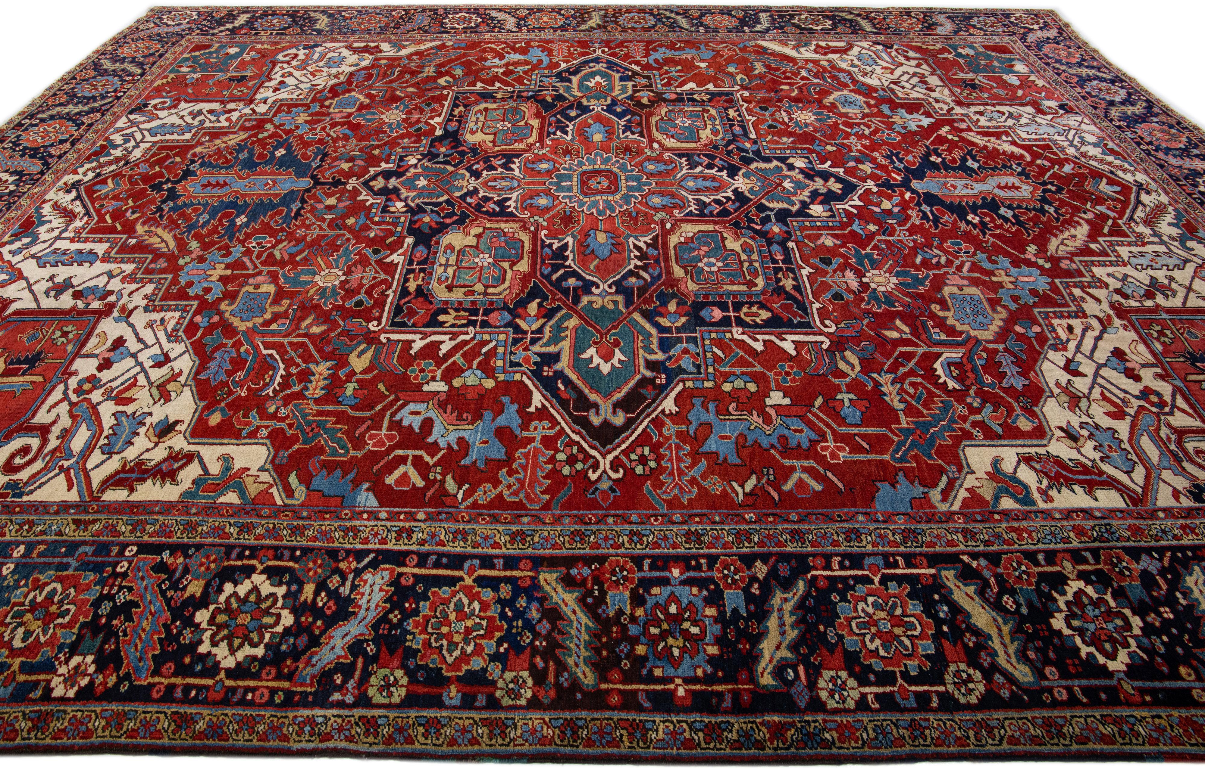 Hand-Knotted Antique Persian Heriz Wool Rug Handmade with Red Medallion Design For Sale