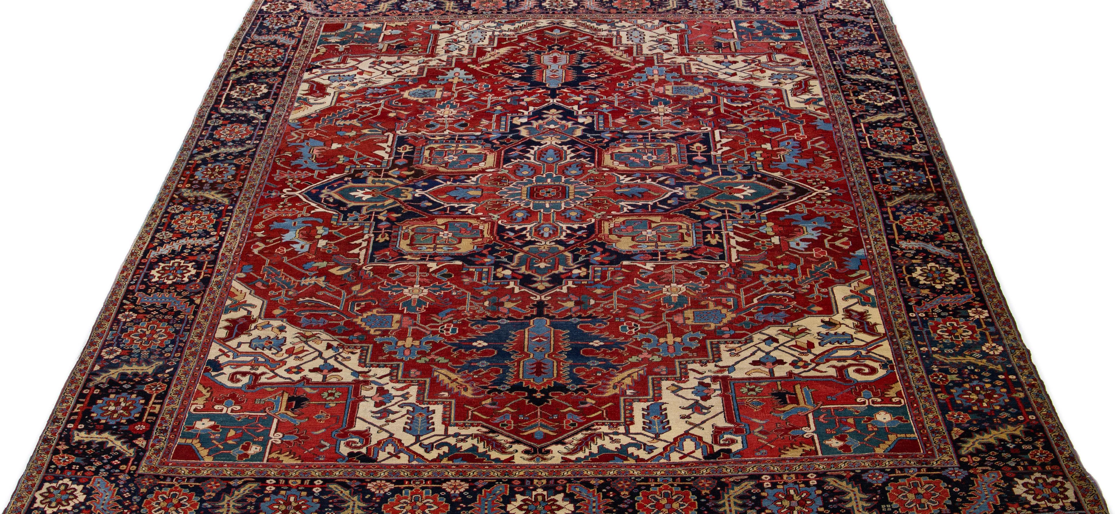 20th Century Antique Persian Heriz Wool Rug Handmade with Red Medallion Design For Sale