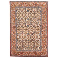 Antico tappeto persiano Isfahan con dettagli floreali colorati su campo centrale avorio