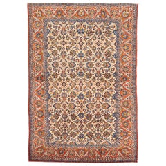 Tapis persan ancien d'Ispahan avec détails floraux colorés sur fond ivoire