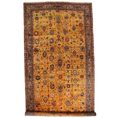 Antico tappeto persiano Isfahan con campo dorato e dettagli floreali, 1910 circa
