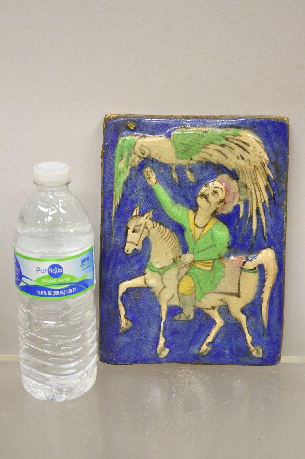 Antique Persian Iznik Qajar Style Blue Ceramic Pottery Tile Horse Rider and Phoenix Bird C4. Item features an original crackle glazed finish, heavy ceramic pottery construction, very impressive detail, wonderful style and form. Great to mount as