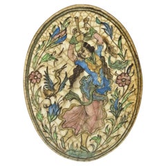 Ancienne poterie persane Iznik Qajar de style céramique carreaux ovales représentant une danseuse bleue C3