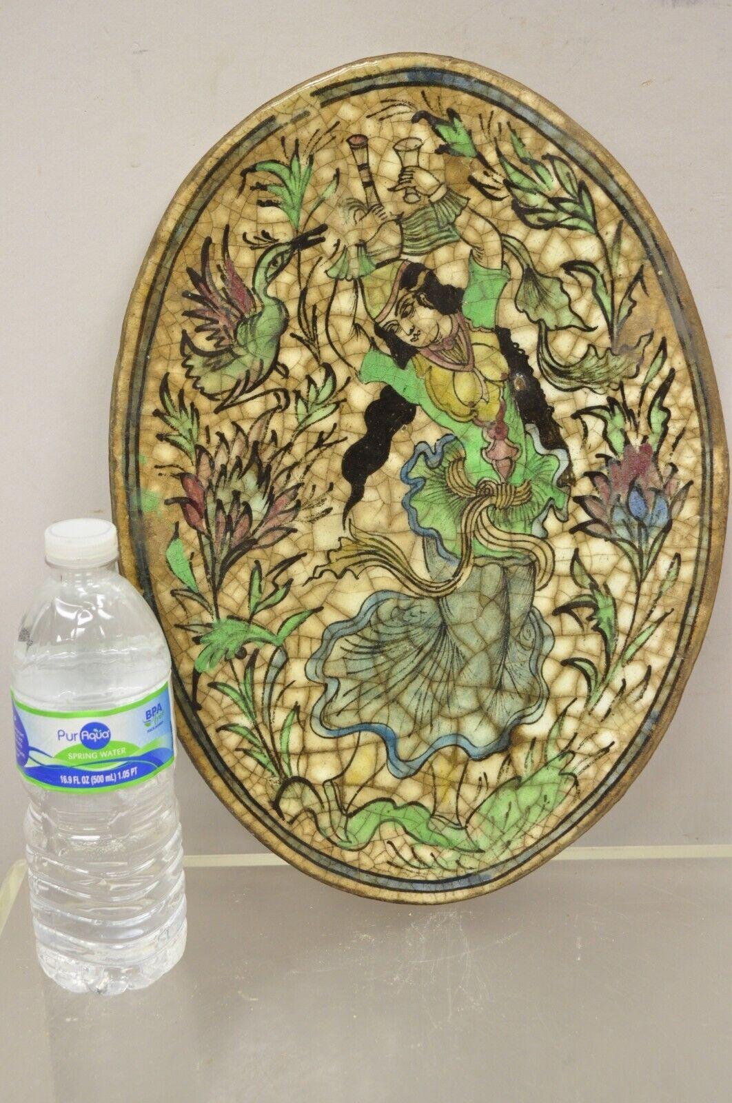 Antique Persian Iznik Qajar Style ceramic pottery green oval title dancing Woman C3. Item features an original crackle glazed finish, heavy ceramic pottery construction, very impressive detail, wonderful style and form. Great to mount as wall art or