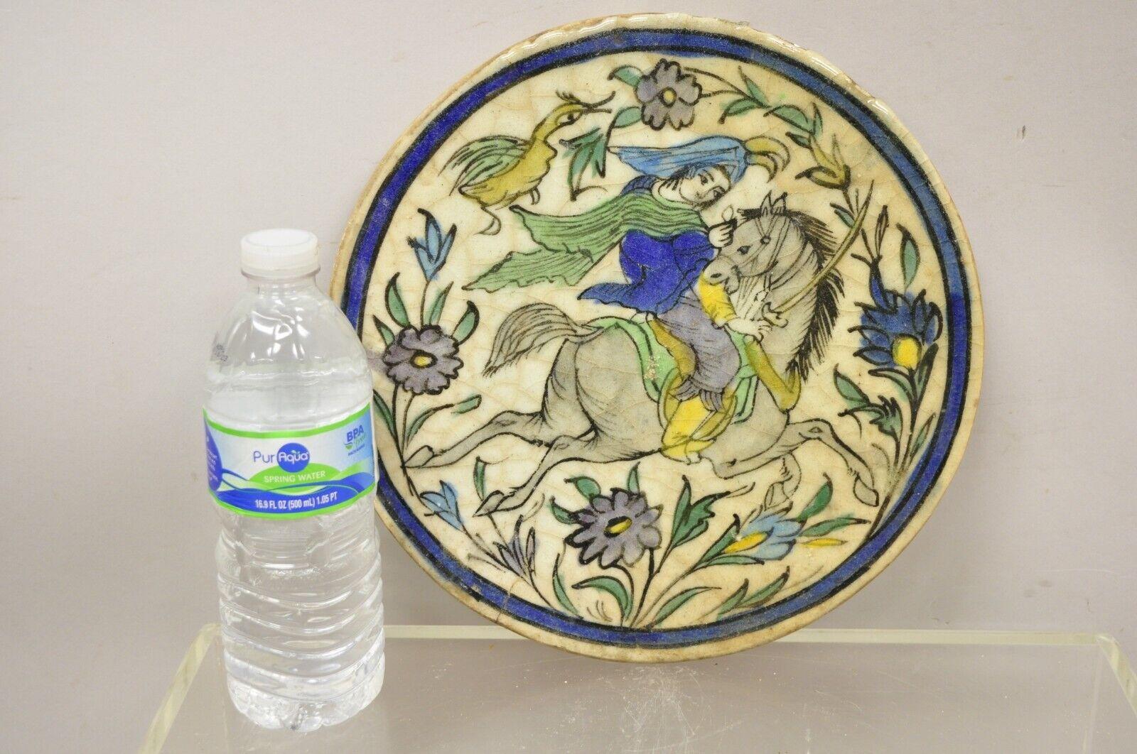 Antique Persian Iznik Qajar style ceramic Pottery round tile horse and rider, blue Garb C4. Item features original crackle glazed finish, heavy ceramic pottery construction, very impressive detail, wonderful style and form. Great to mount as wall