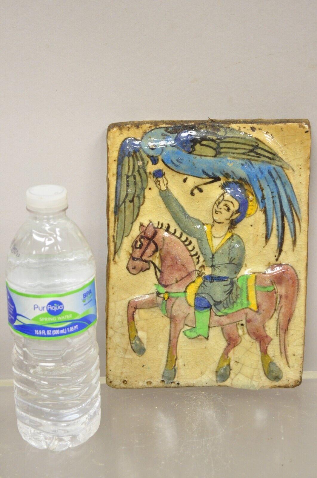 Antique Persian Iznik Qajar style ceramic pottery beige tile Phoenix bird and horse Rider C4. Item features original crackle glazed finish, heavy ceramic pottery construction, very impressive detail, wonderful style and form. Great to mount as wall