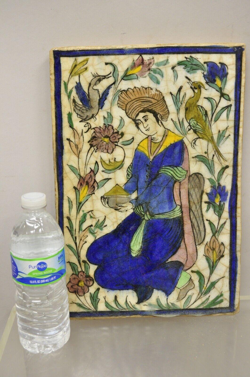 Antique Persian Iznik Qajar Style Ceramic Pottery Tile Figure with Blue Garb C2. Item features an original crackle glazed finish, heavy ceramic pottery construction, very impressive detail, wonderful style and form. Great to mount as wall art or