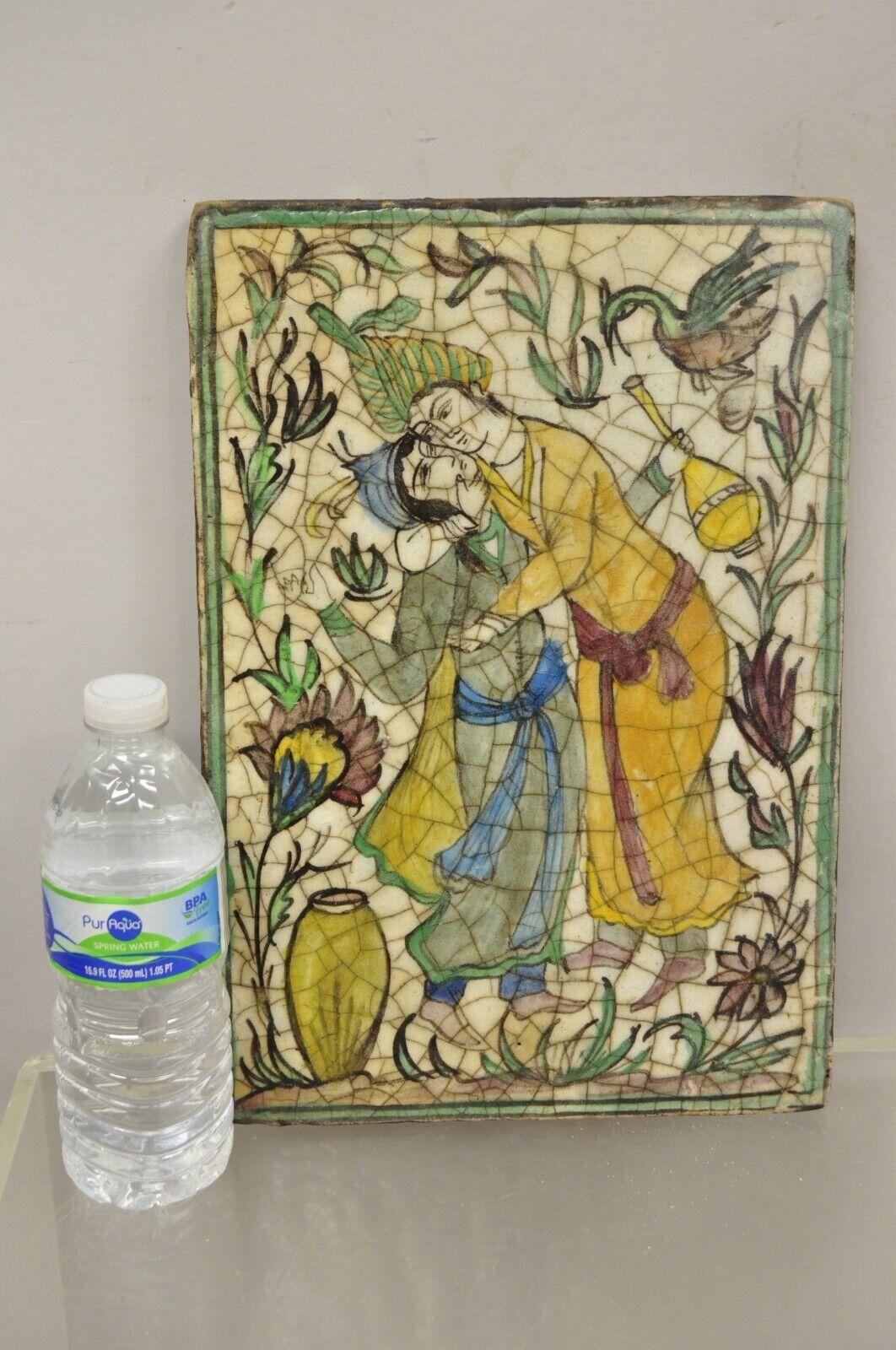 Antique Persian Iznik Qajar Style Ceramic Pottery Tile Green Man and Lady Embrace C2. Item features an original crackle glazed finish, heavy ceramic pottery construction, very impressive detail, wonderful style and form. Great to mount as wall art