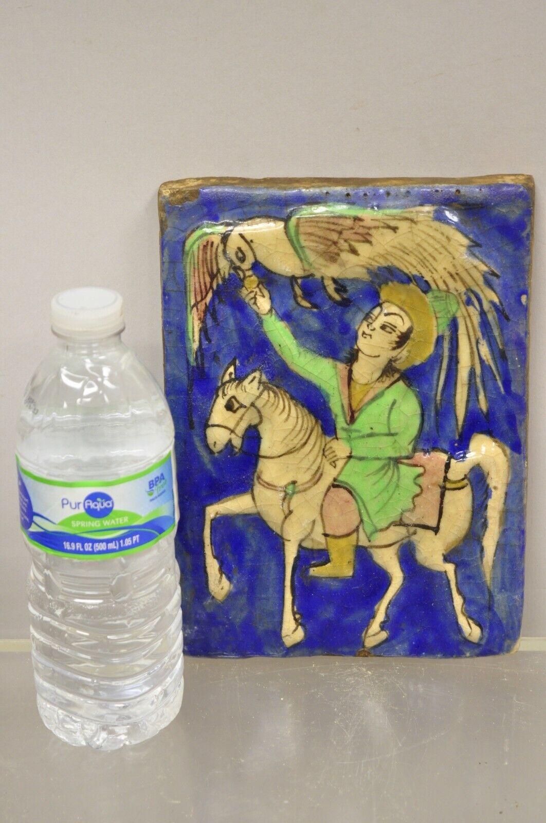 Antique Persian Iznik Qajar Style Blue Ceramic Pottery Tile Horse Rider with Green Garb and Phoenix Bird C4. Item features original crackle glazed finish, heavy ceramic pottery construction, very impressive detail, wonderful style and form. Great to