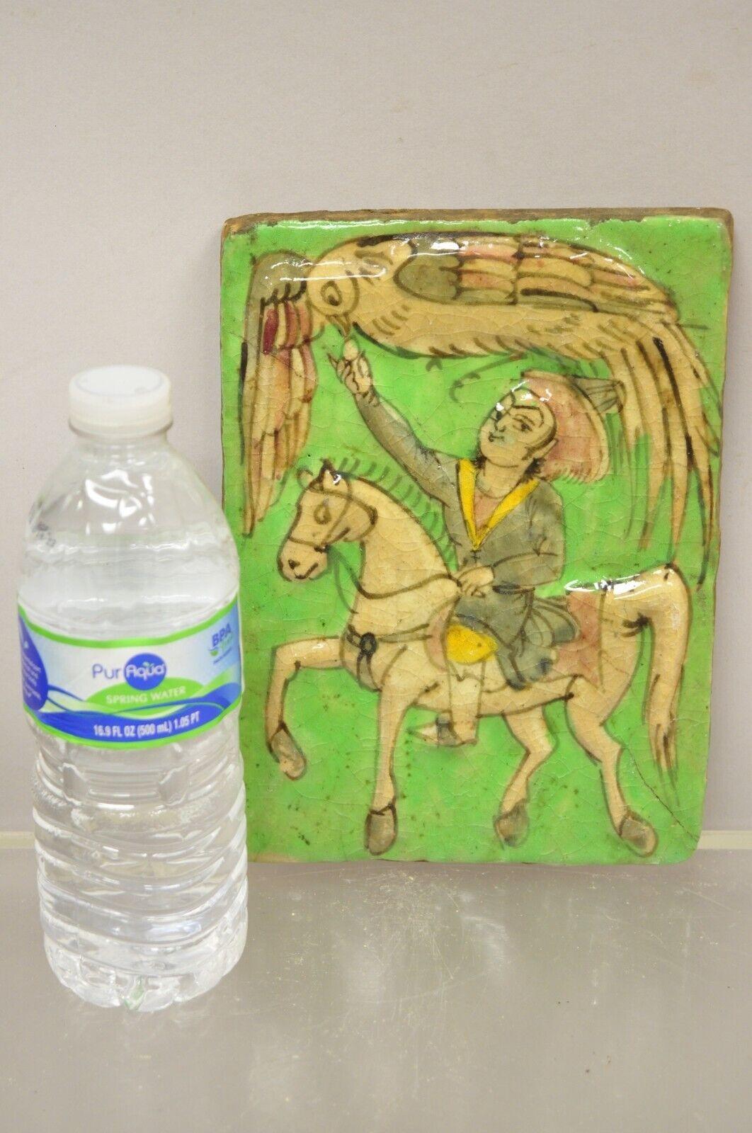 Antique Persian Iznik Qajar Style Green Ceramic Pottery Tile Phoenix Bird and Horse Rider C4. Item features original crackle glazed finish, heavy ceramic pottery construction, very impressive detail, wonderful style and form. Great to mount as wall